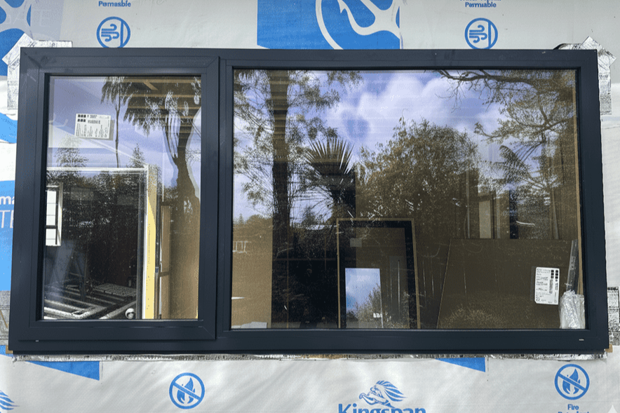 New aluminium window ready for installation, supplied as part of a renovation window replacement service.