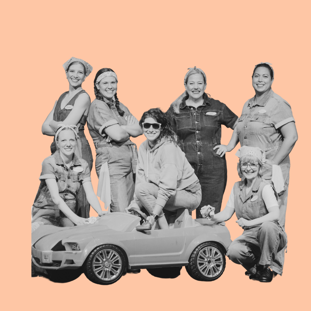 Adults next to a small car