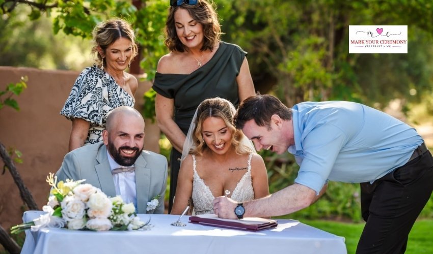 couple-signing-legal-document-after-marriage