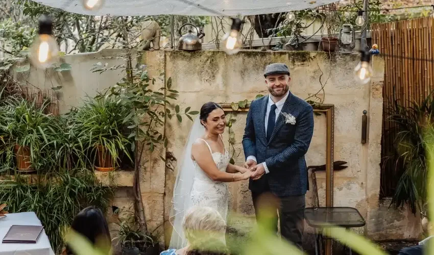 bride-and-groom-holding-hands