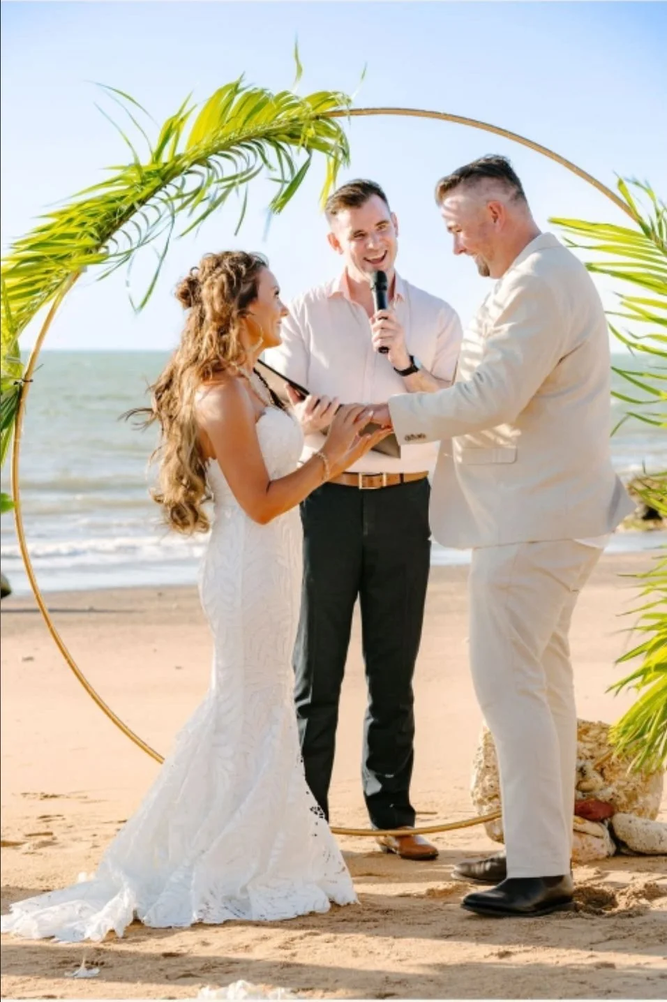 seaside-wedding-vows-celebrant-holding-microphone