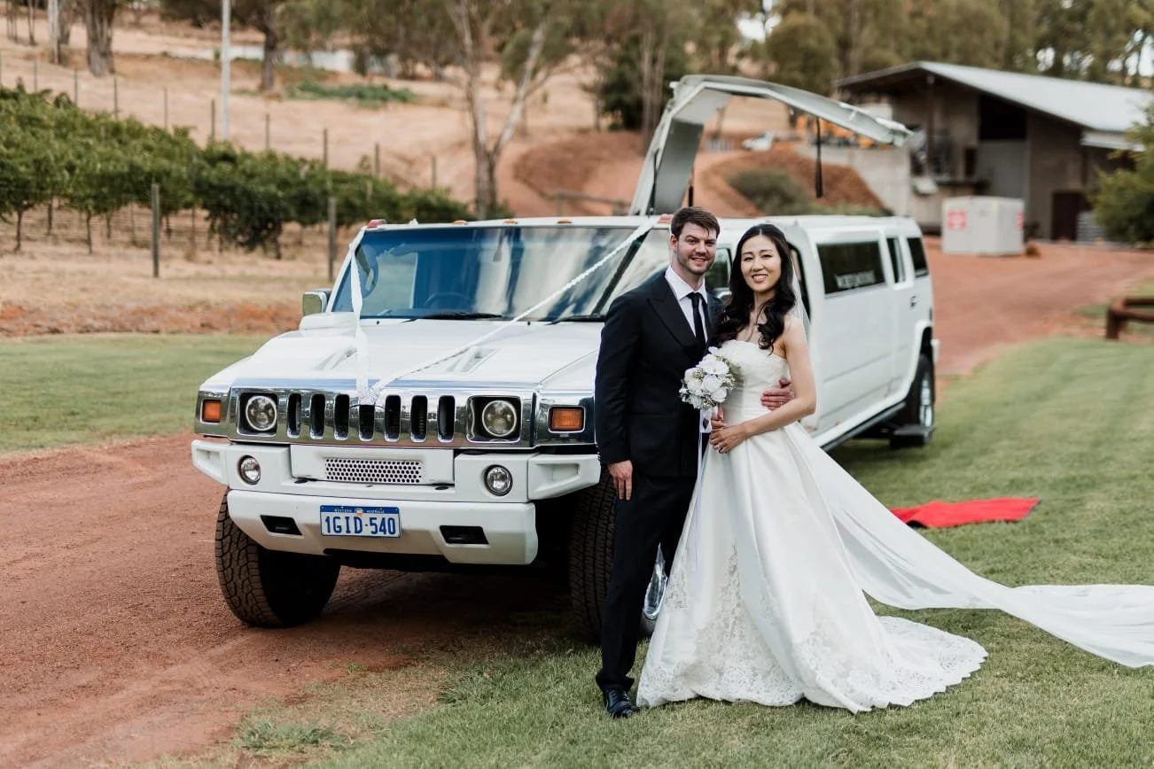 couple infront of wedding car