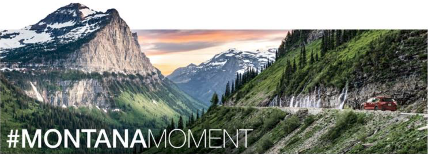 A scenic view of a mountain valley with snow-capped peaks, green forests, and a winding road with a red car. Sunset lighting enhances the natural landscape.