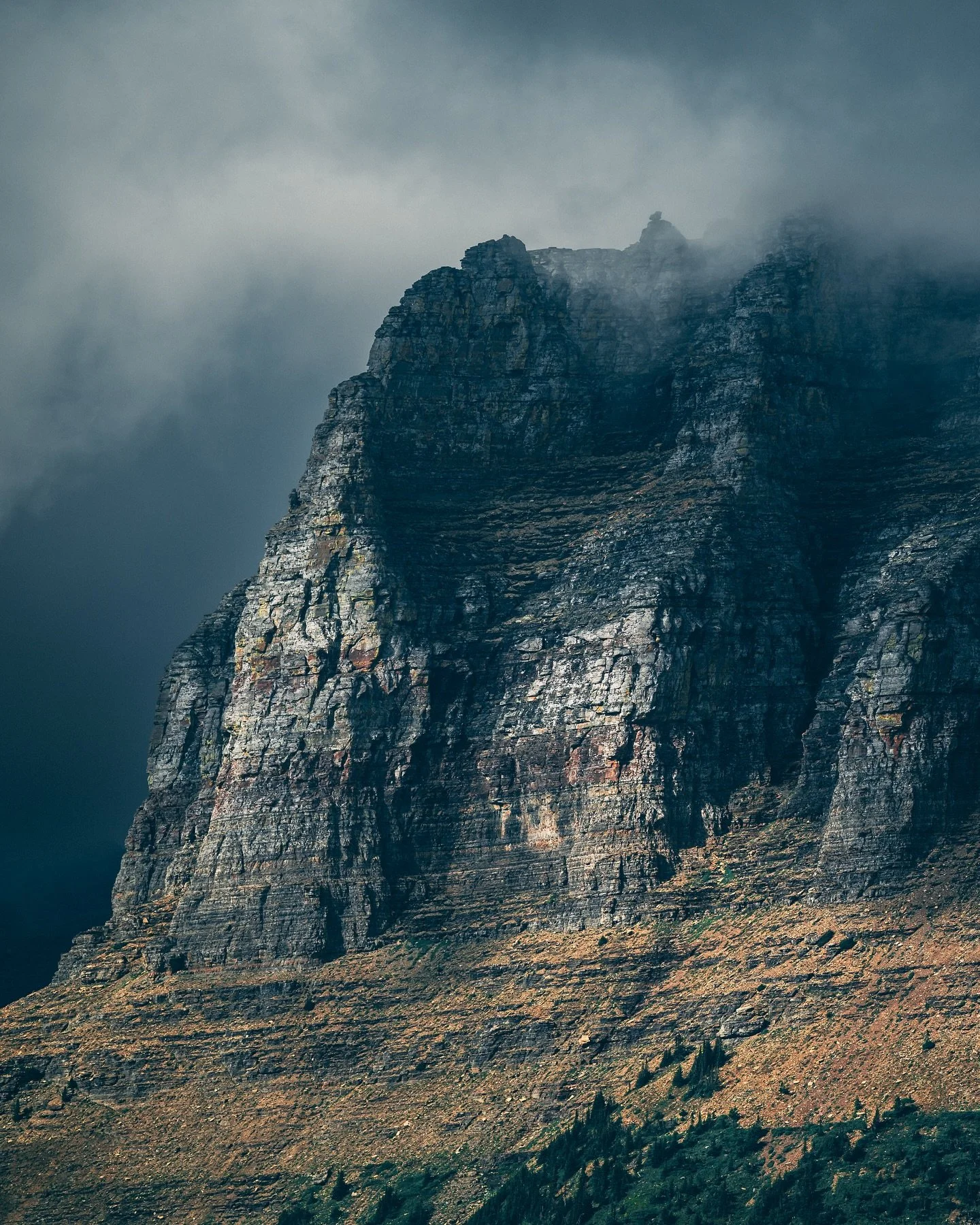 A break in the clouds. 

A rainy day along Going to the Sun brought some of the most incredible lighting and a great opportunity to break out the telephoto lens to capture the mountains across the valley. 
&bull;
&bull;
#GlacierNationalPark #MontanaL