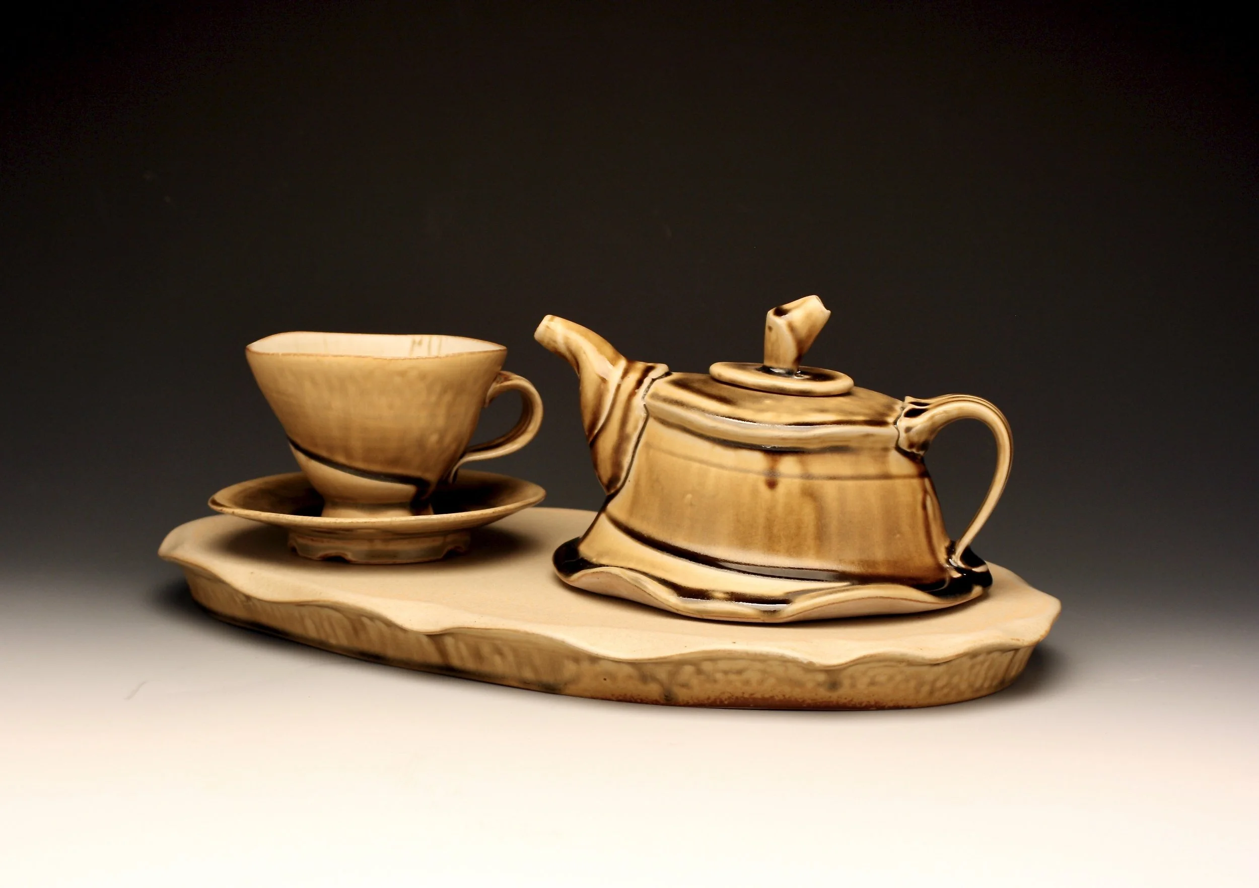 Tea for one set by Conner Burns.  Teapot, cup, saucer, tray. Glazed to c9 oxidation with ash glaze.