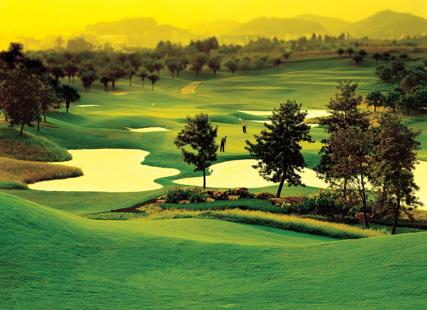 golf course in china with water and an island green