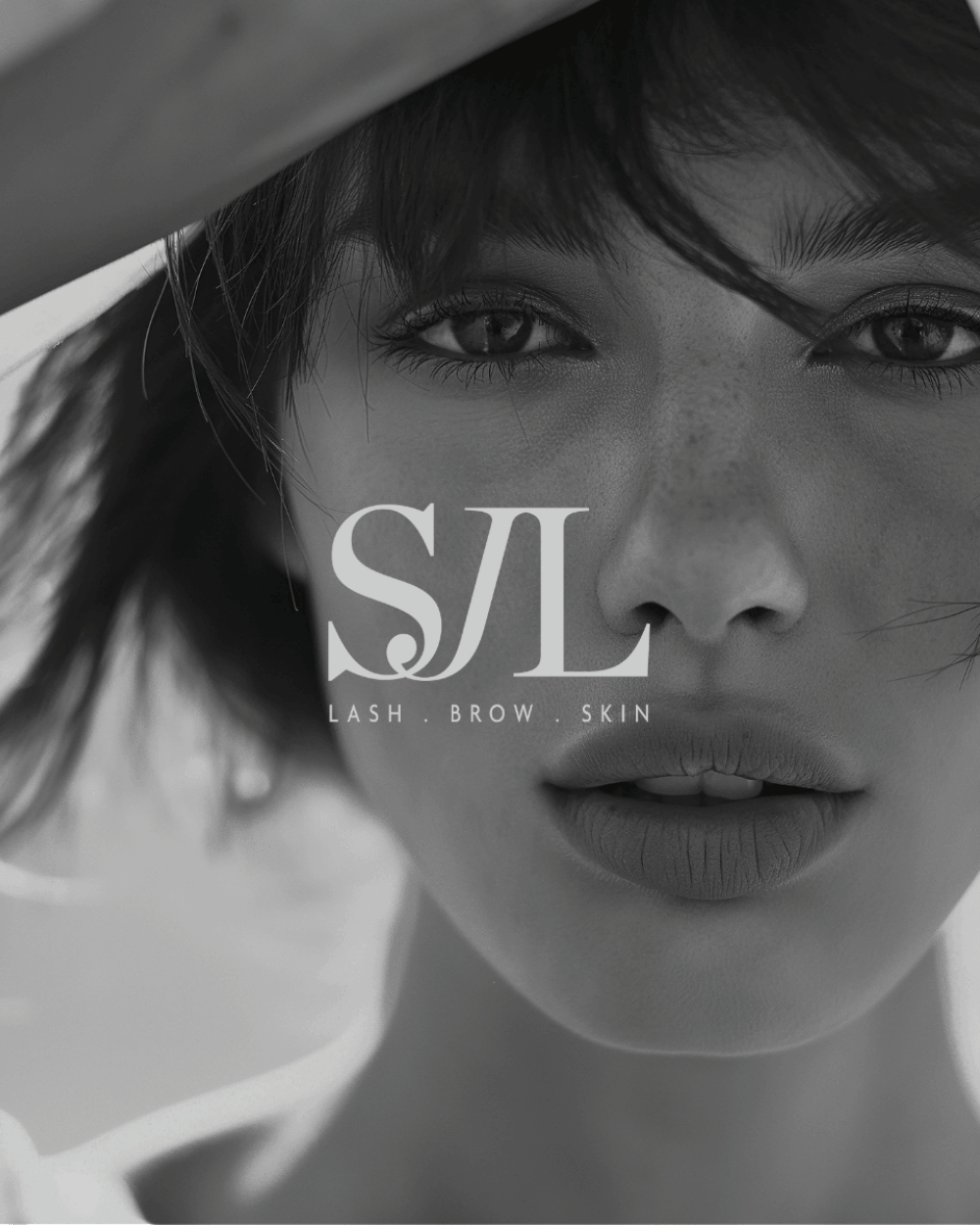 SJL logo sitting a top the face of a beautiful woman