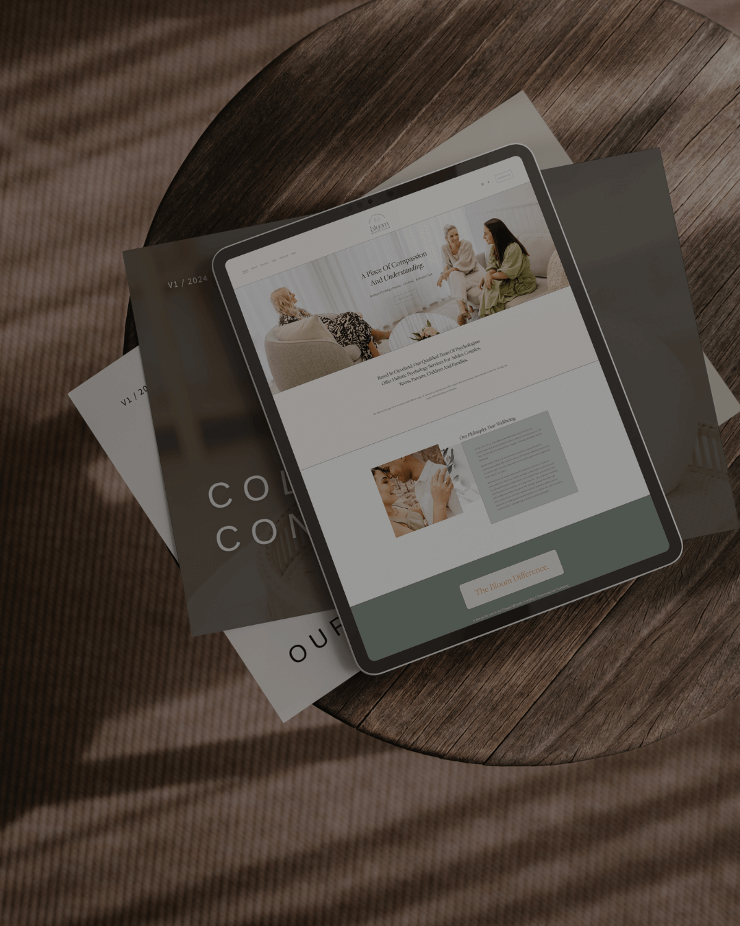 ipad on a brown coffee table with website mock up