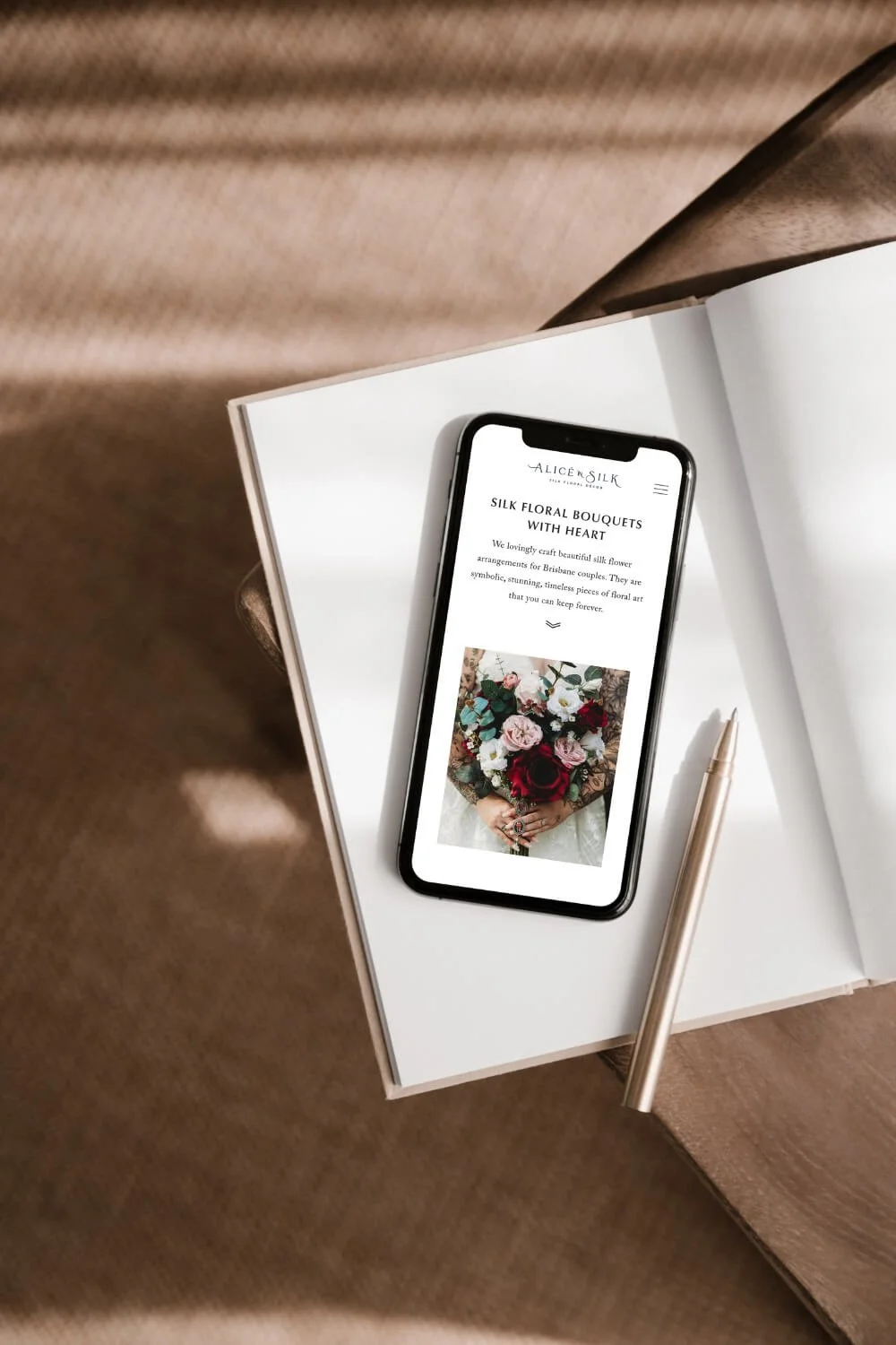 Alice in Silk website mock up image on iphone