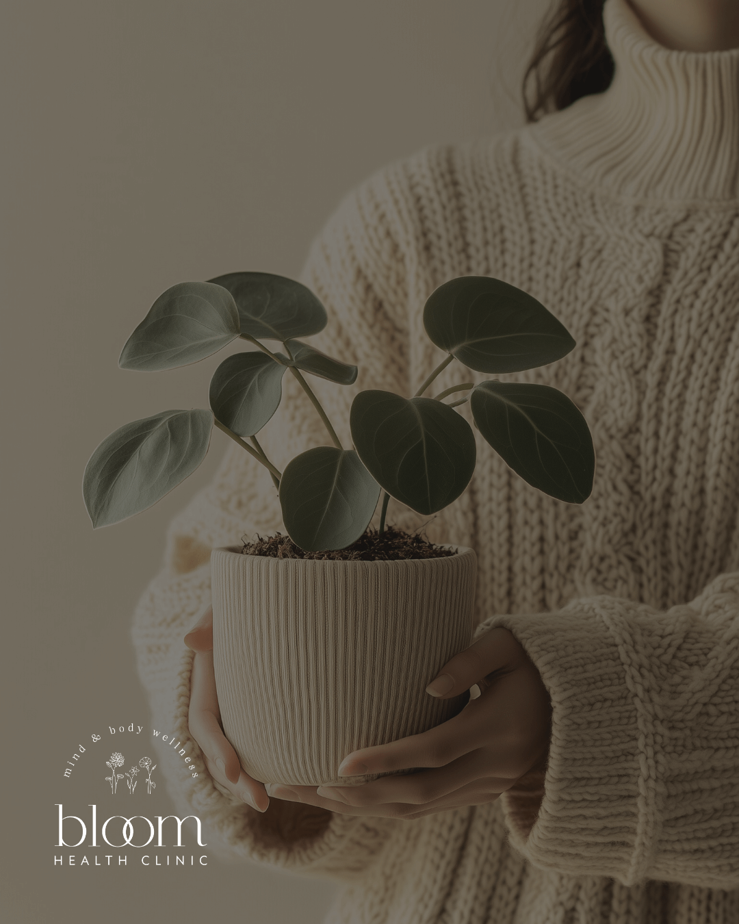 Woman holding a plant with branding logo