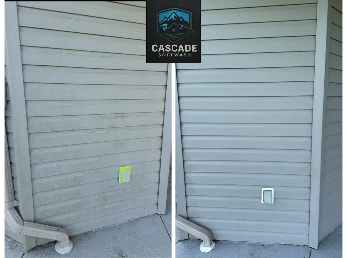 Side-by-side comparison of an external wall with vinyl siding, showing before and after cleaning. The left side has dirty siding with visible grime and a small yellow object on the wall, while the right side shows clean siding with a white frame and 