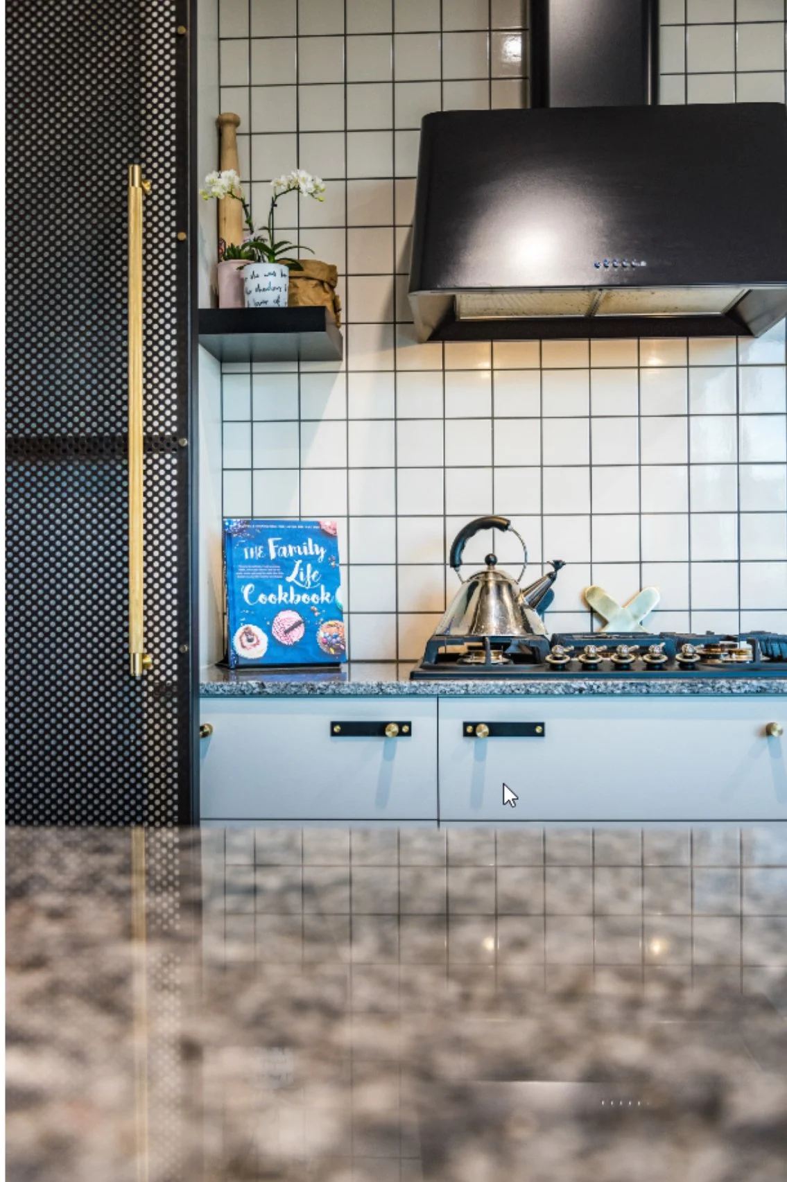 Interior perforated sliding screen. perforated screen. perforated kitchen screen. interior designed perf panels