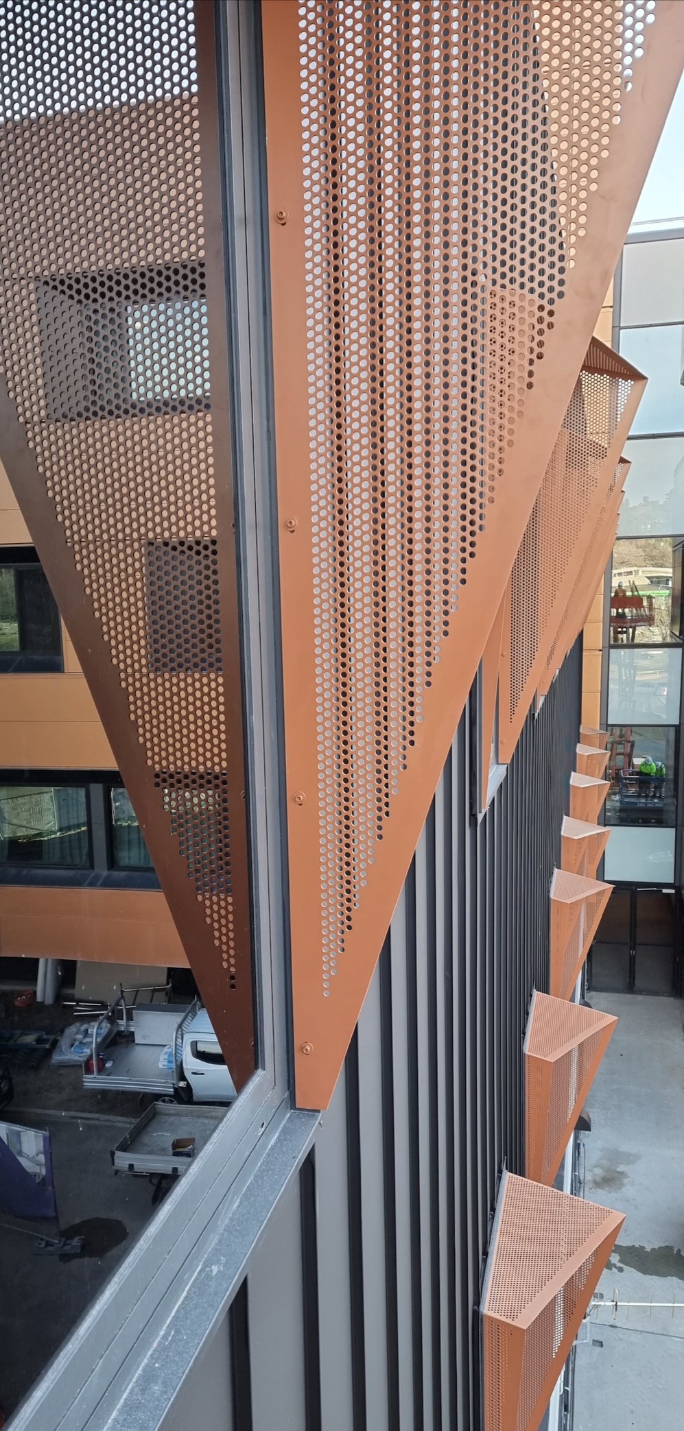perforated window hoods. corten. Canberra hospital. privacy screening hoods