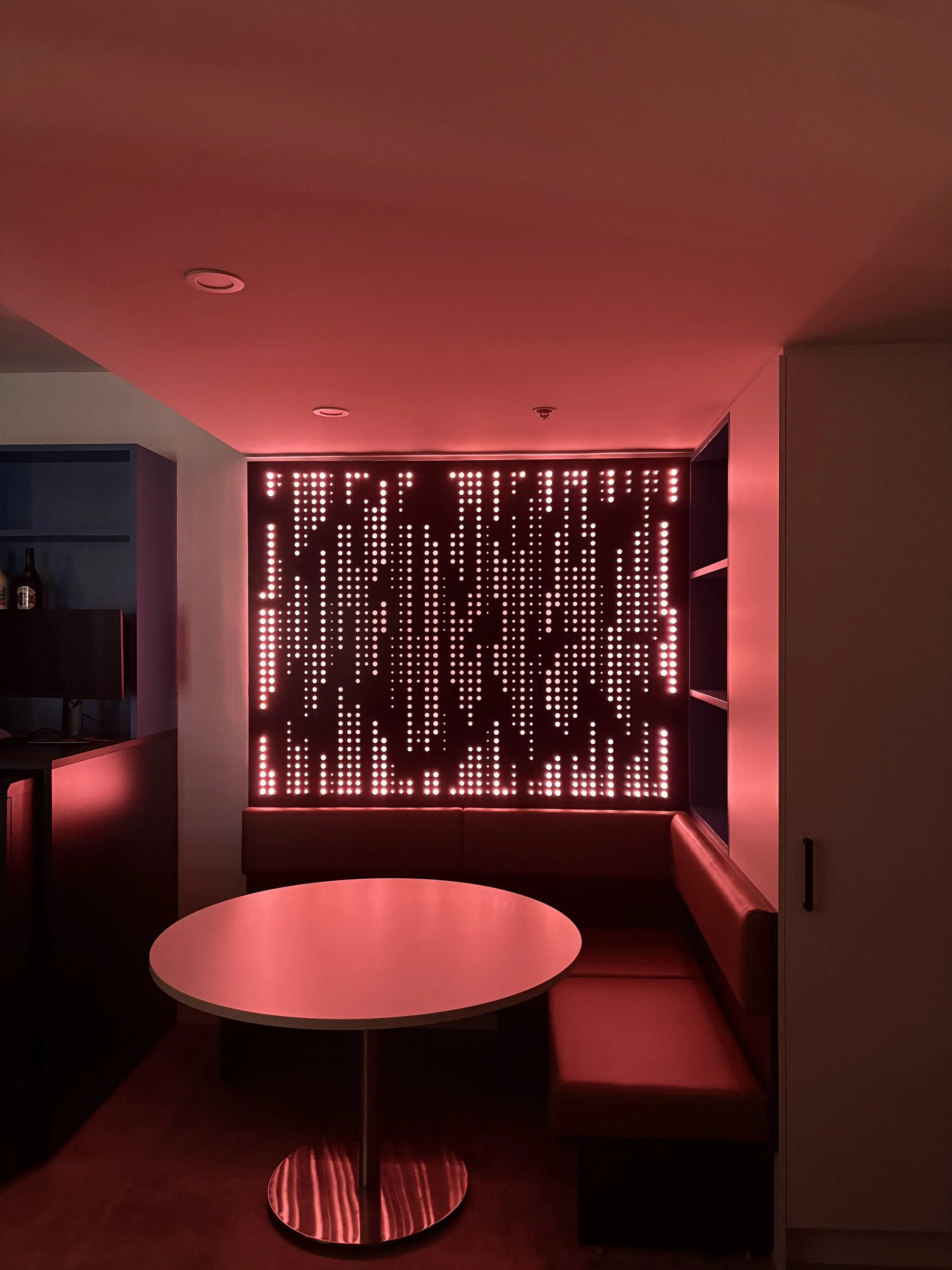 Custom designed feature artwork panels for banquet seating. Interior design. Techno pattern. Laser cut with back lighting