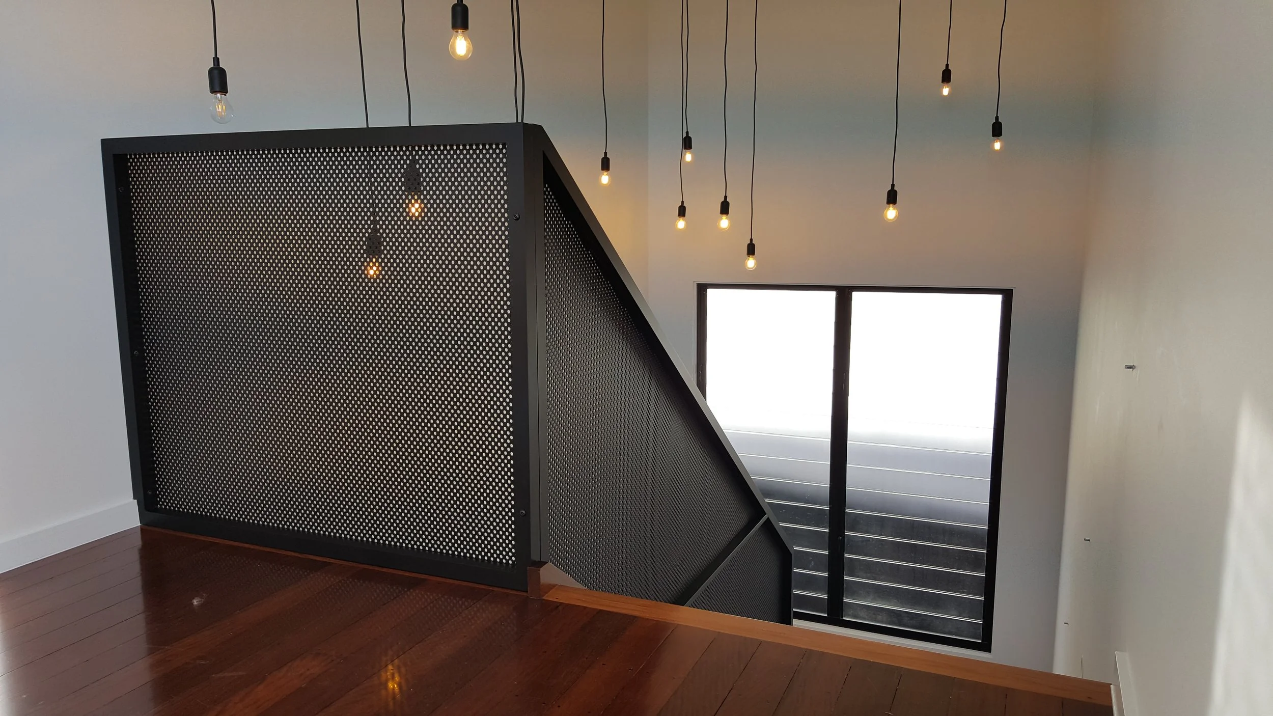 interior perforated balustrade. custom designed balustrade. pic perf