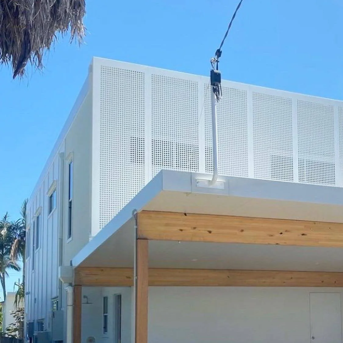 Perforated privacy screen. Custom designed in contemporary square pattern. Perforated home facade