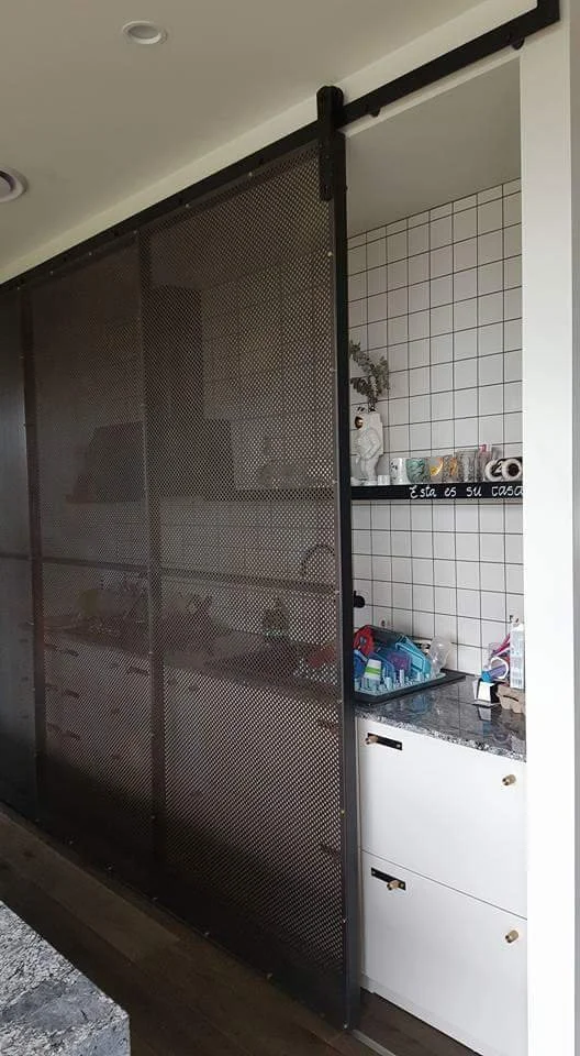 custom designed screen for private residence in Brisbane. Kitchen safety screen protecting stove area from autistic child within the home, material, rusted corten steel with clear coated finish