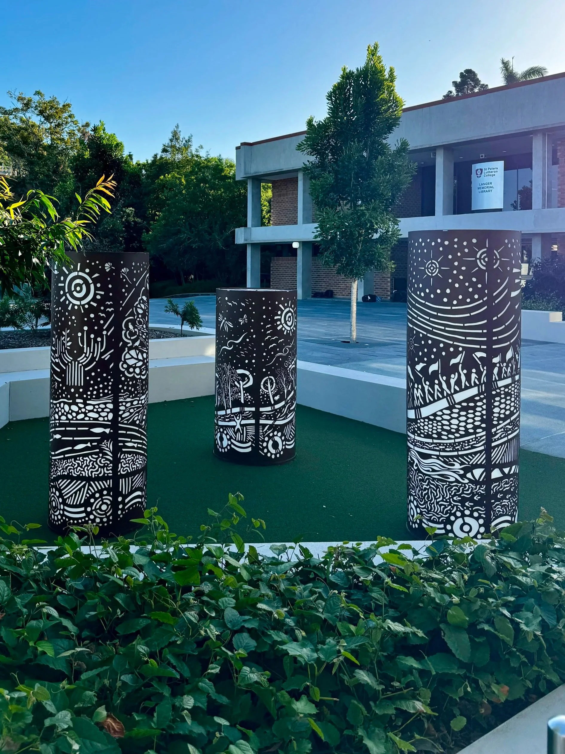 Custom designed story telling light towers. Designed in collaboration with Luke Mallie artist, Deborah Bauer, Urban Metal and St Peters Anglican College