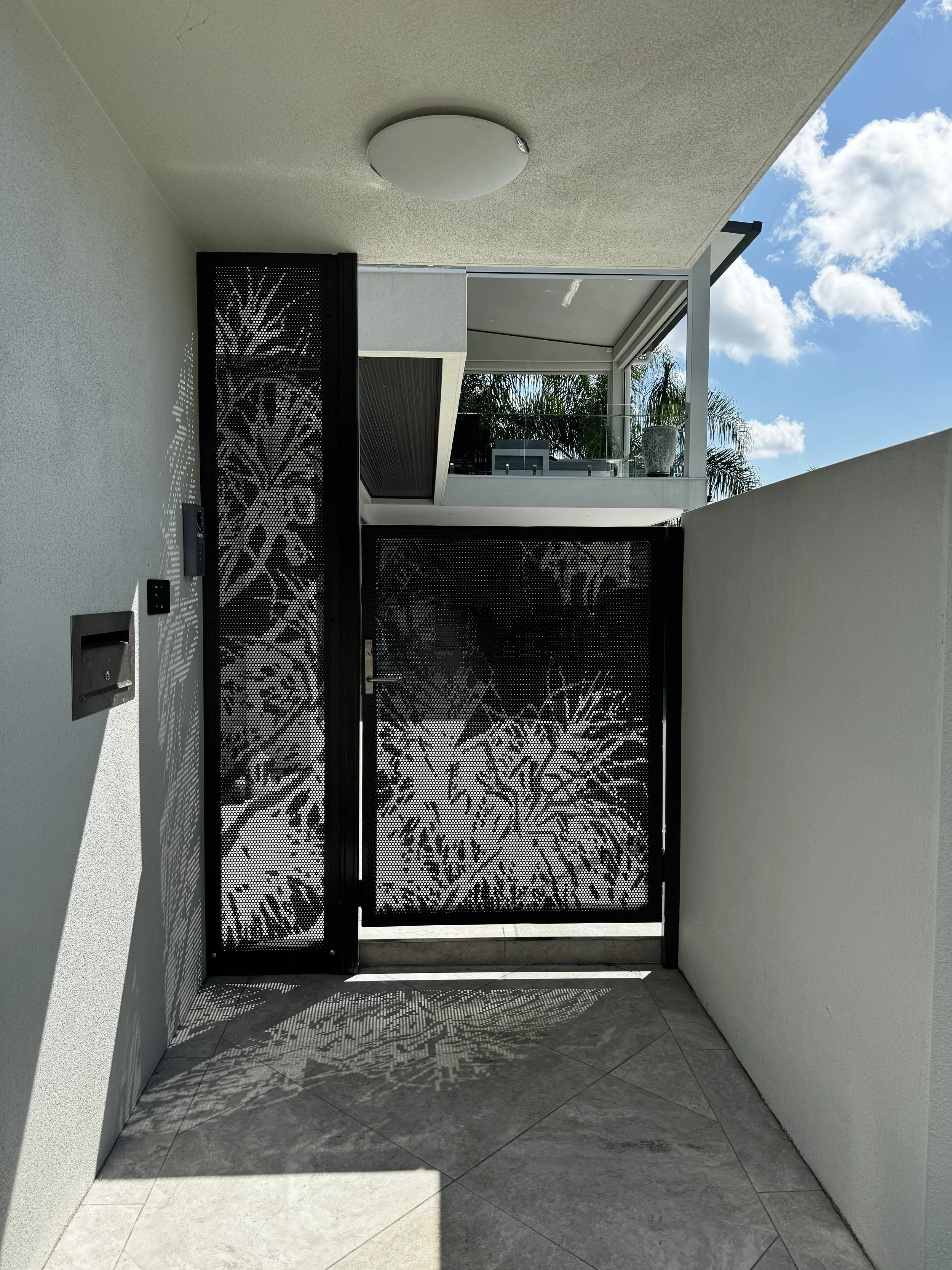 custom designed perforated panels. perforated gate panel. perforated fencing screens. perforated pandanus design