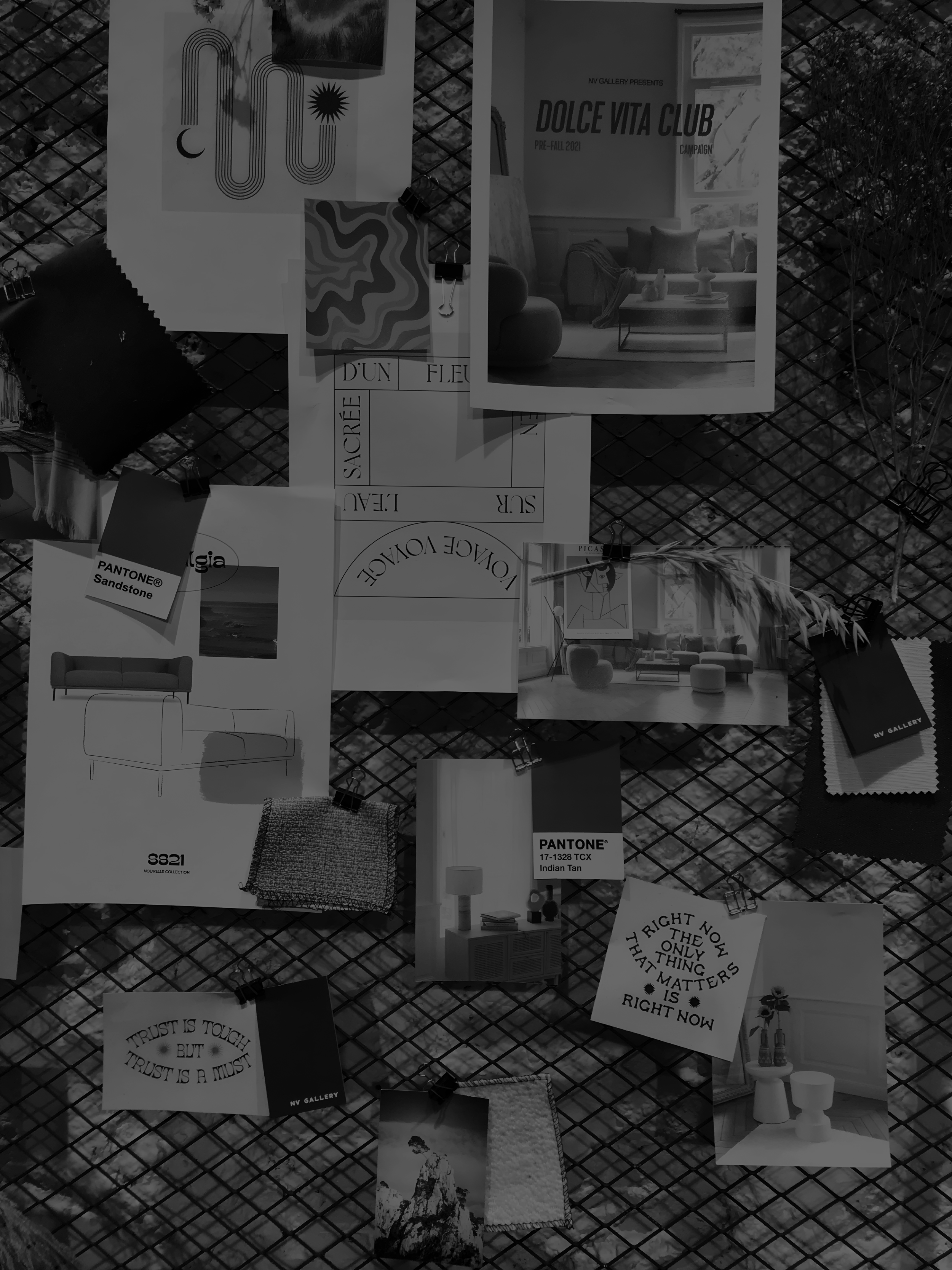 A collage of photographs, artwork, fabric swatches, and quotes pinned to a wire grid display, likely part of an interior design or art project.