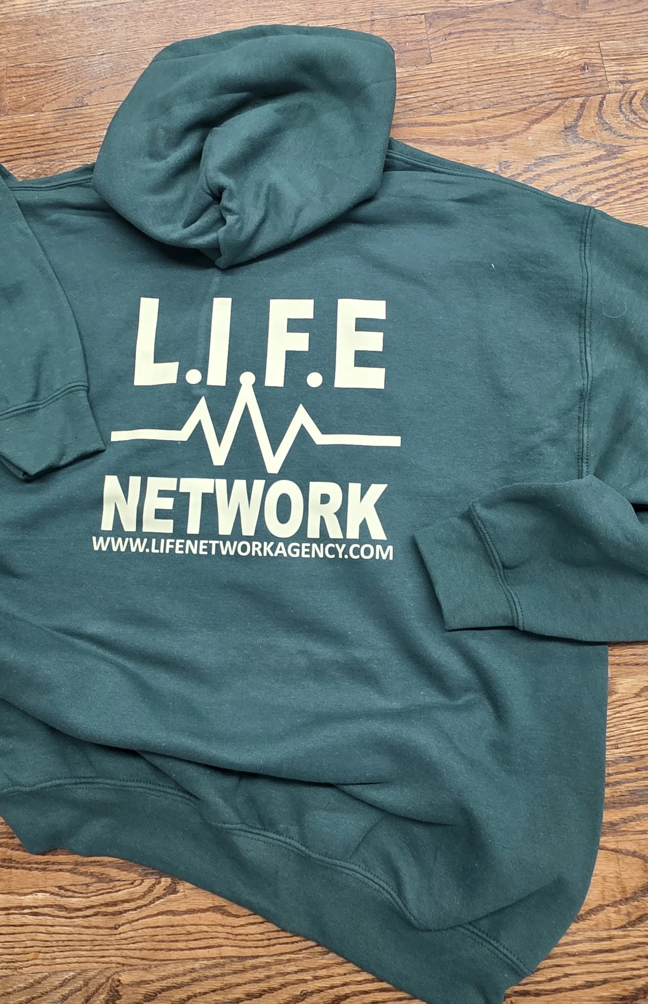 Green Hoodie w cream writting.jpg