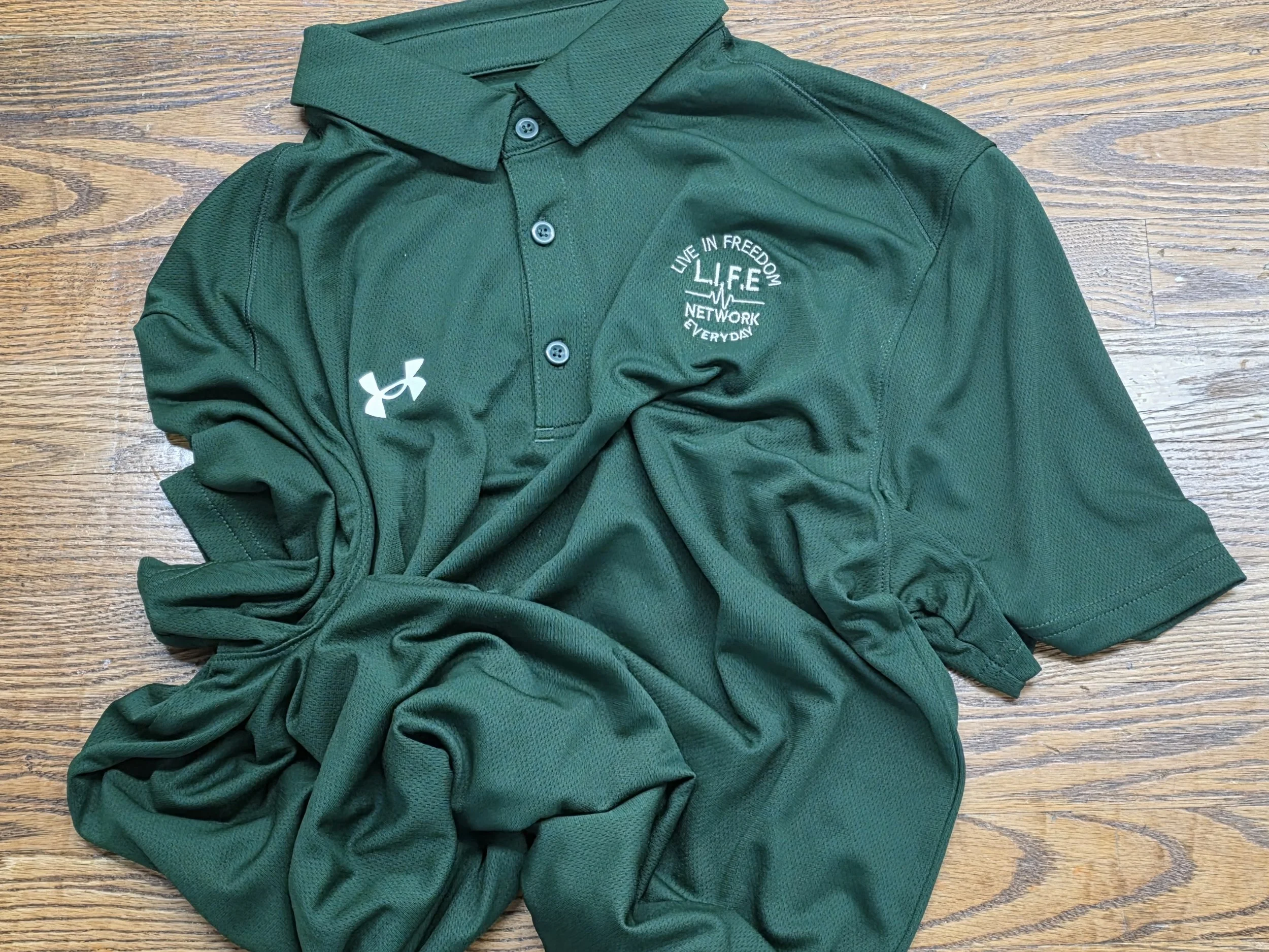 Forrest Green UA Polo w - cream writting.jpg