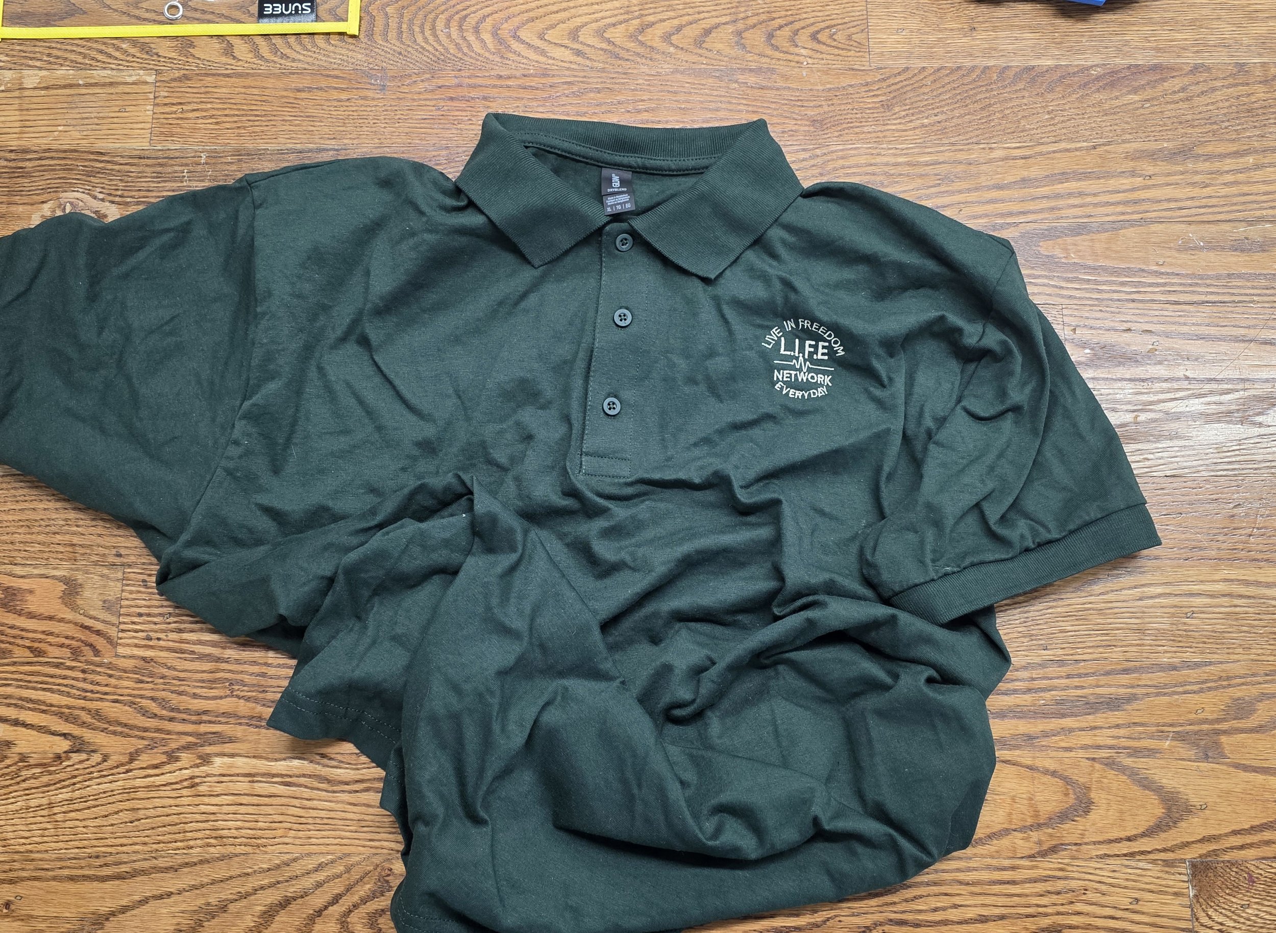 Forrest Green Gildan Polo w - cream writting.jpg