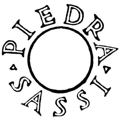 Circular logo with the words 'SPIE DRAIS' and 'ASS' around a blank circle in the center.