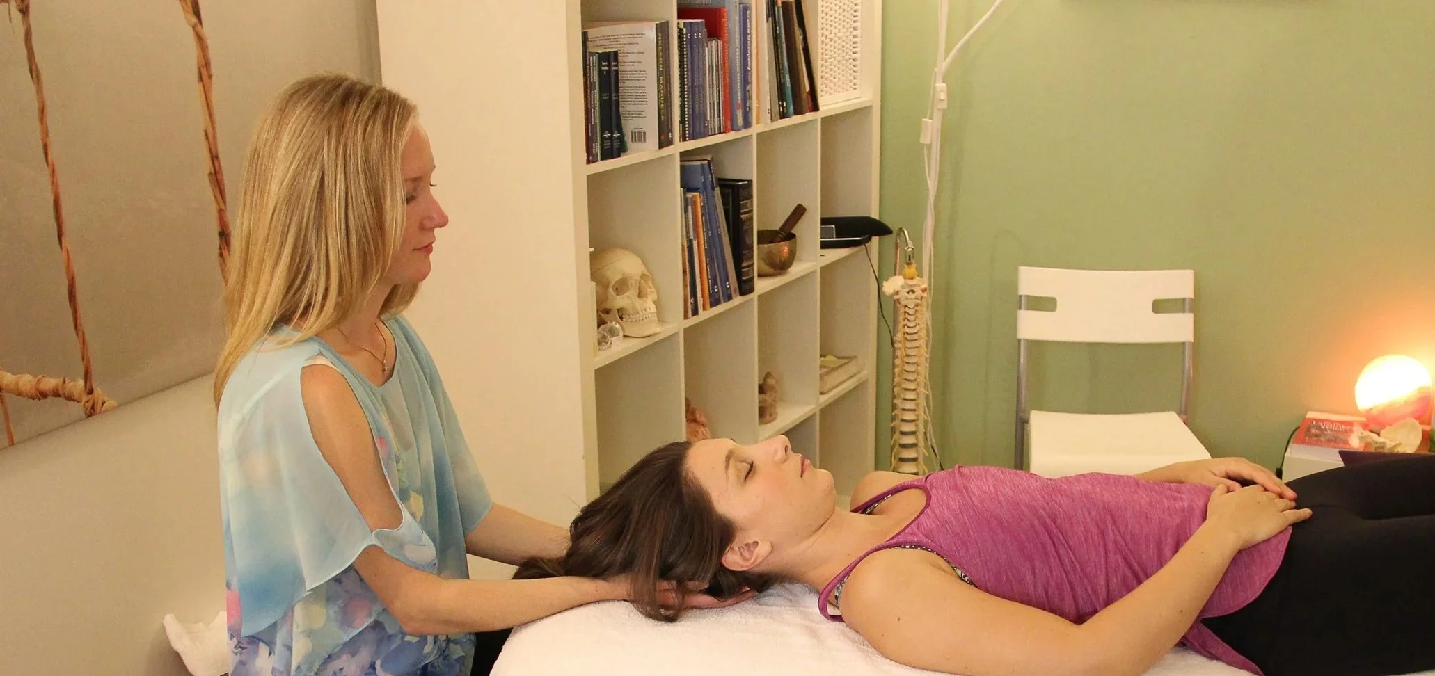Illustration of three golf holes on a course, each with flagsticks and cups, against a background of trees and hills.
