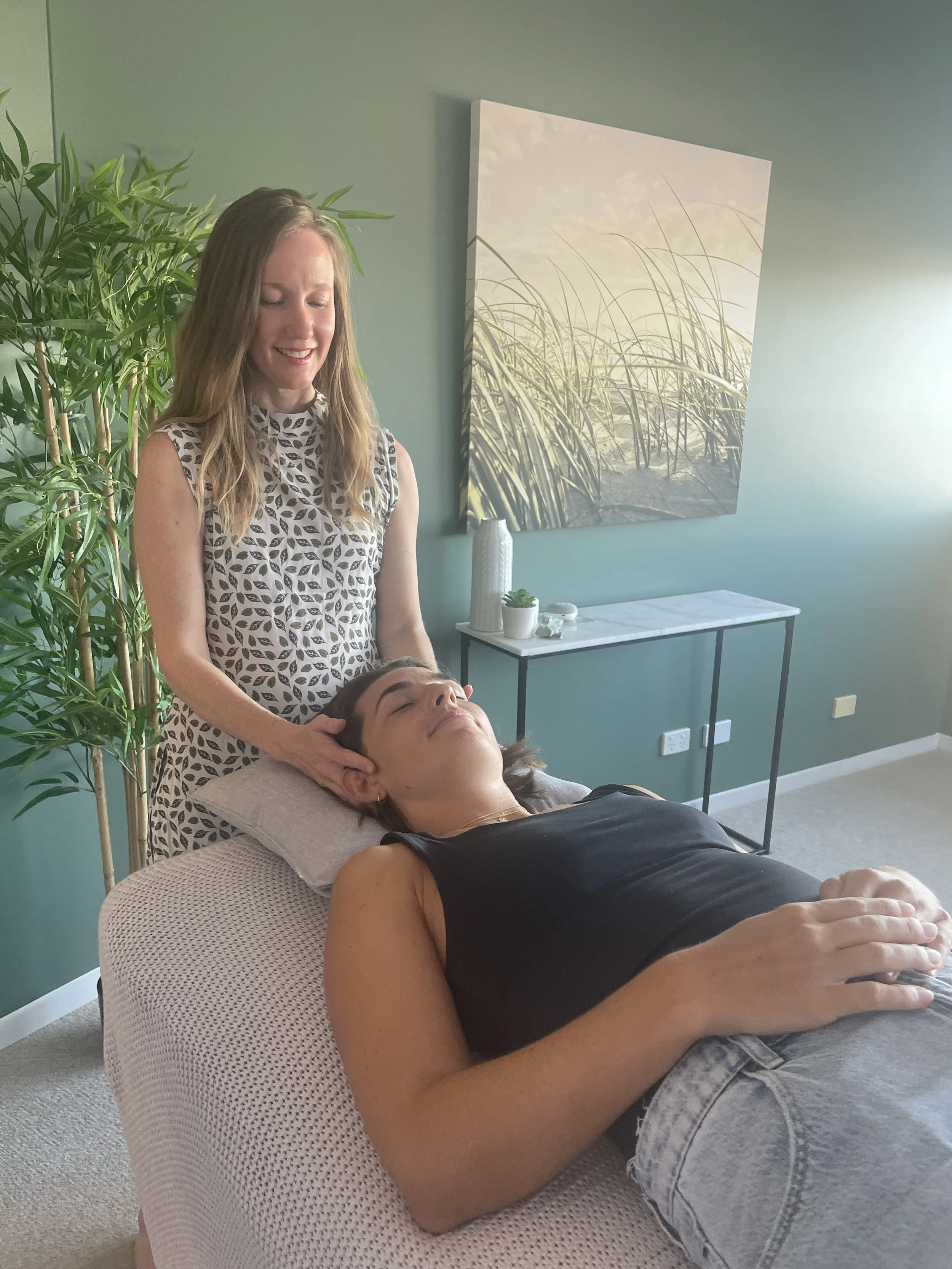 Woman receiving gentle hands-on treatment