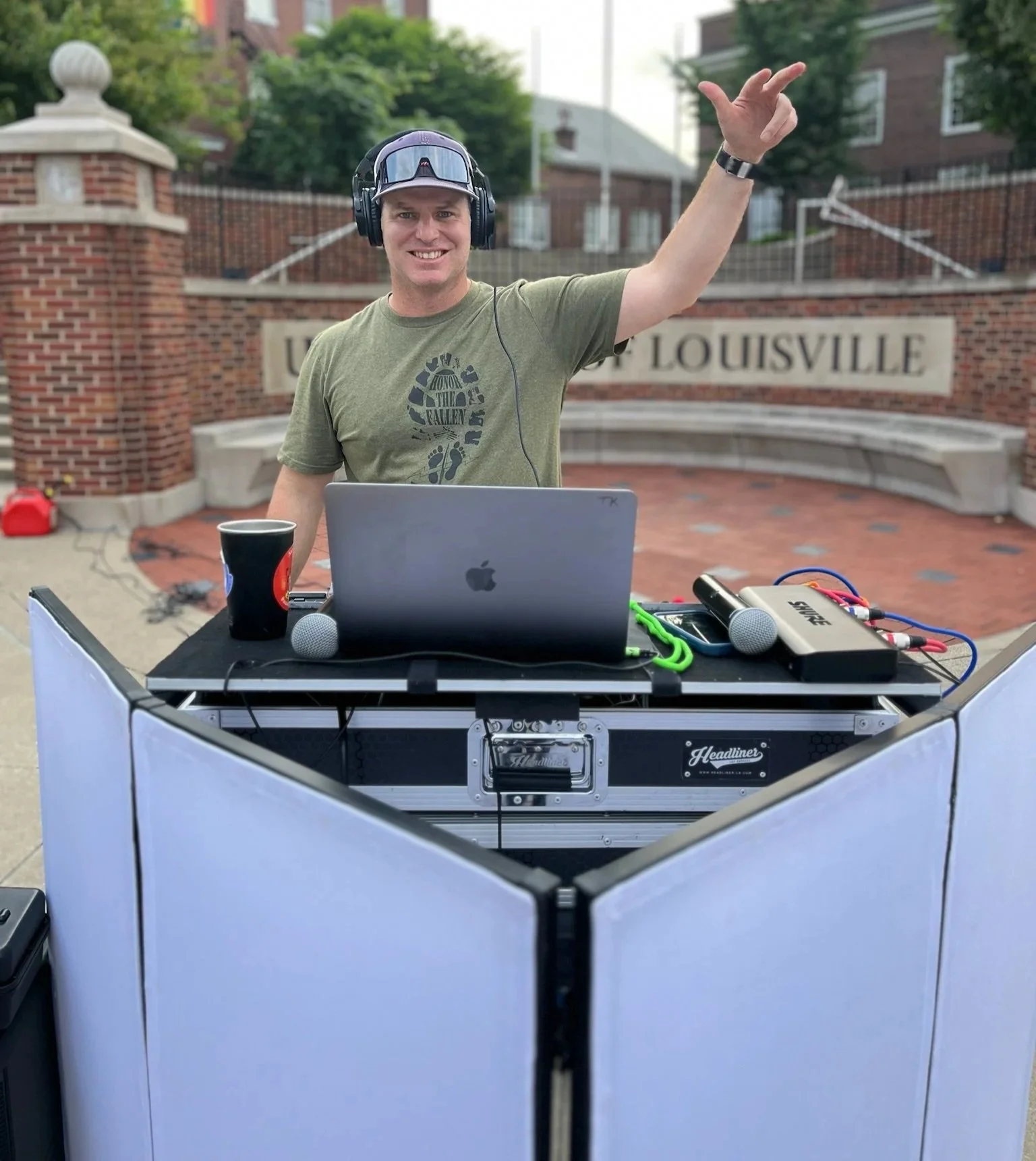 Troy Kenning, founder of Discover Service, DJing at a community event to bring people together and create engaging, youth-focused experiences.
