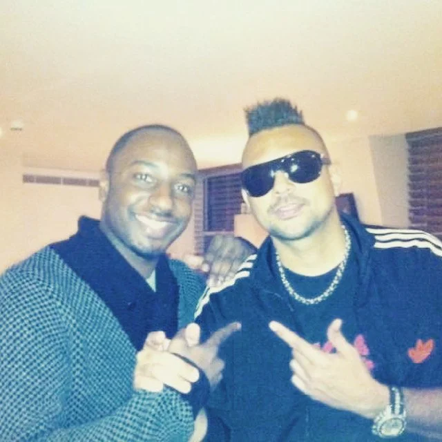 DJ Mr Drew standing next to Dancehall artist, Sean Paul.