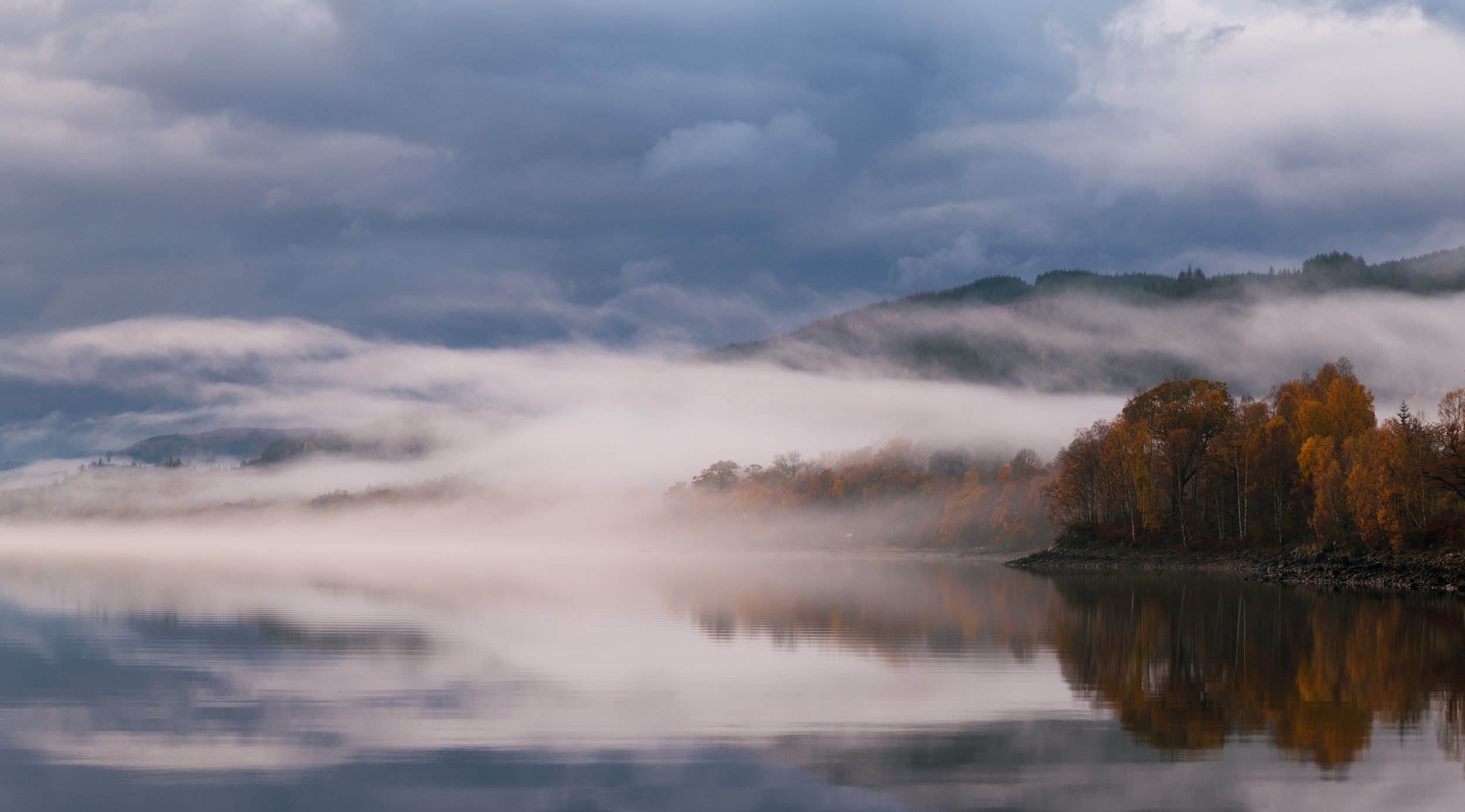 Mist hanging over an autumnal Loch Garry.