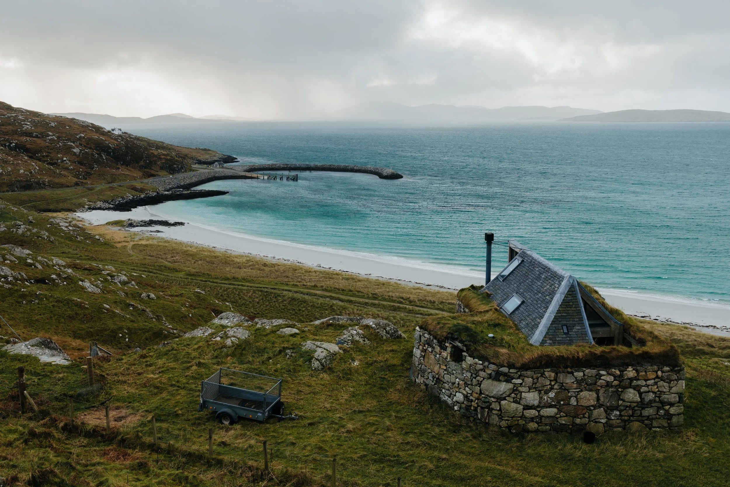 A small stone house overlooking Price Charlie's Bay on the Isle of Eriskay.