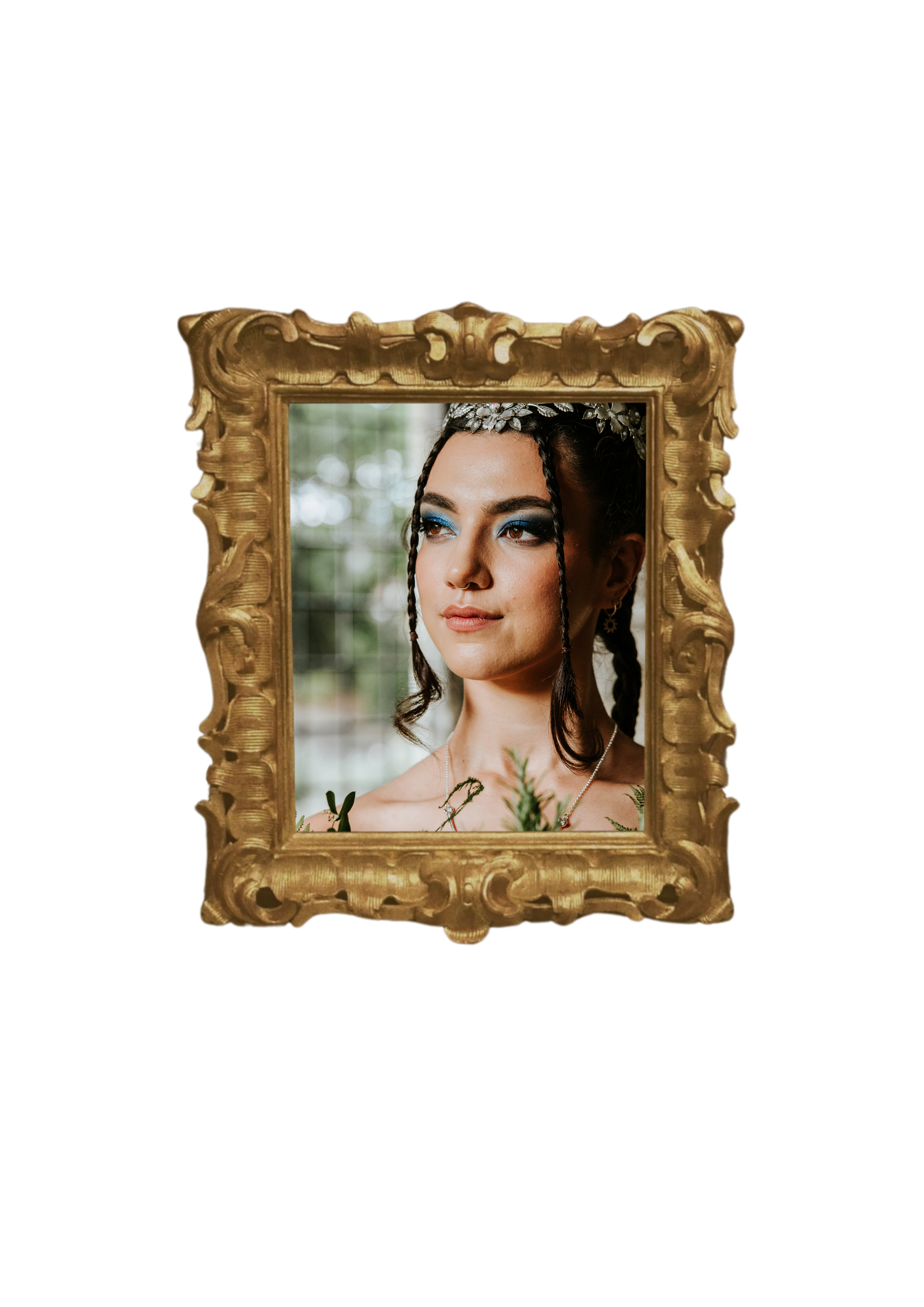 A woman with dark hair in braids and blue eyeshadow is looking to the side inside an ornate gold picture frame. The background shows a blurred greenery scene.