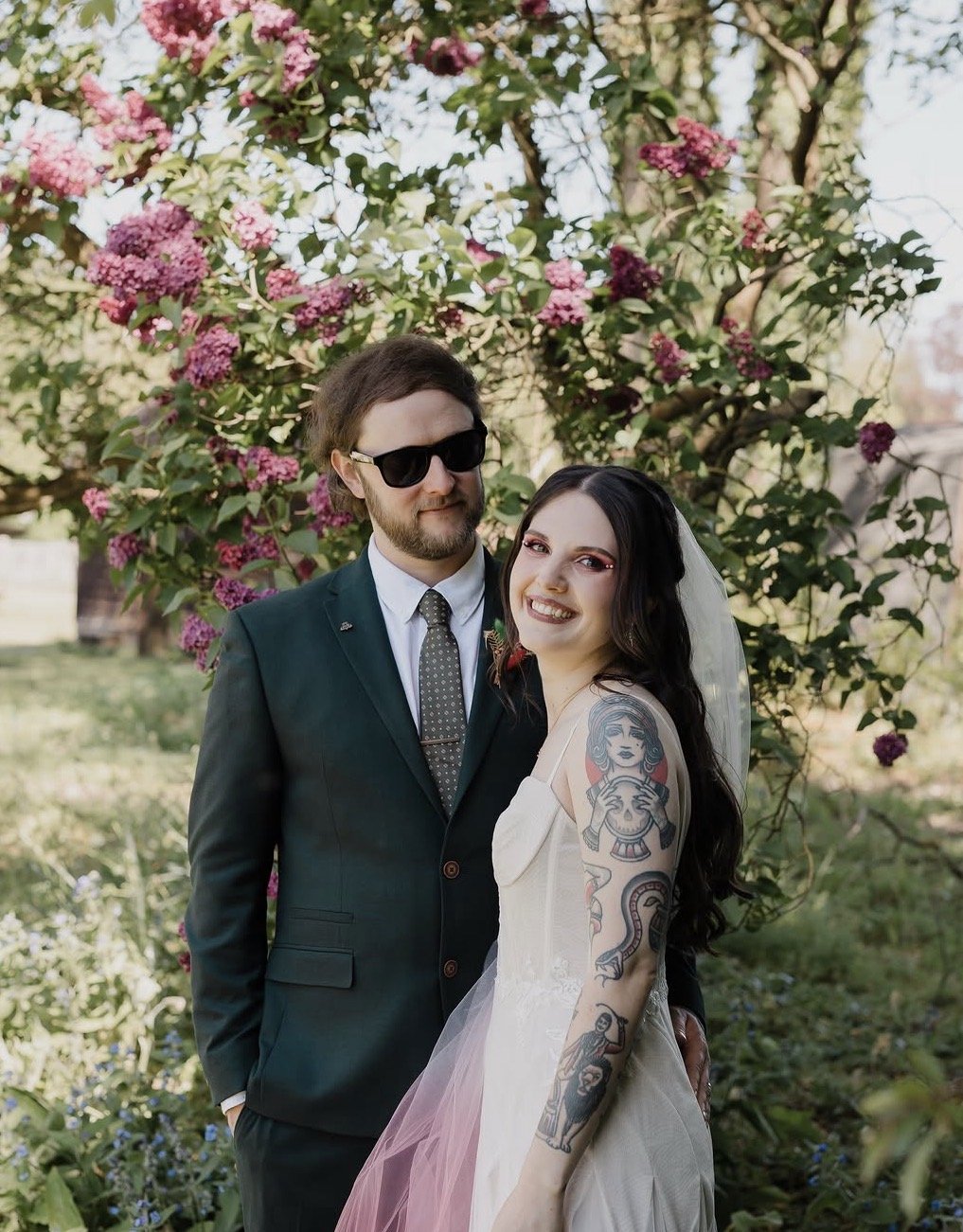 A bride and groom, bride is wearing hot pink glam makeup with pearl accents. Hair & Makeup by Katie
Photo by Michael Harden Weddings.