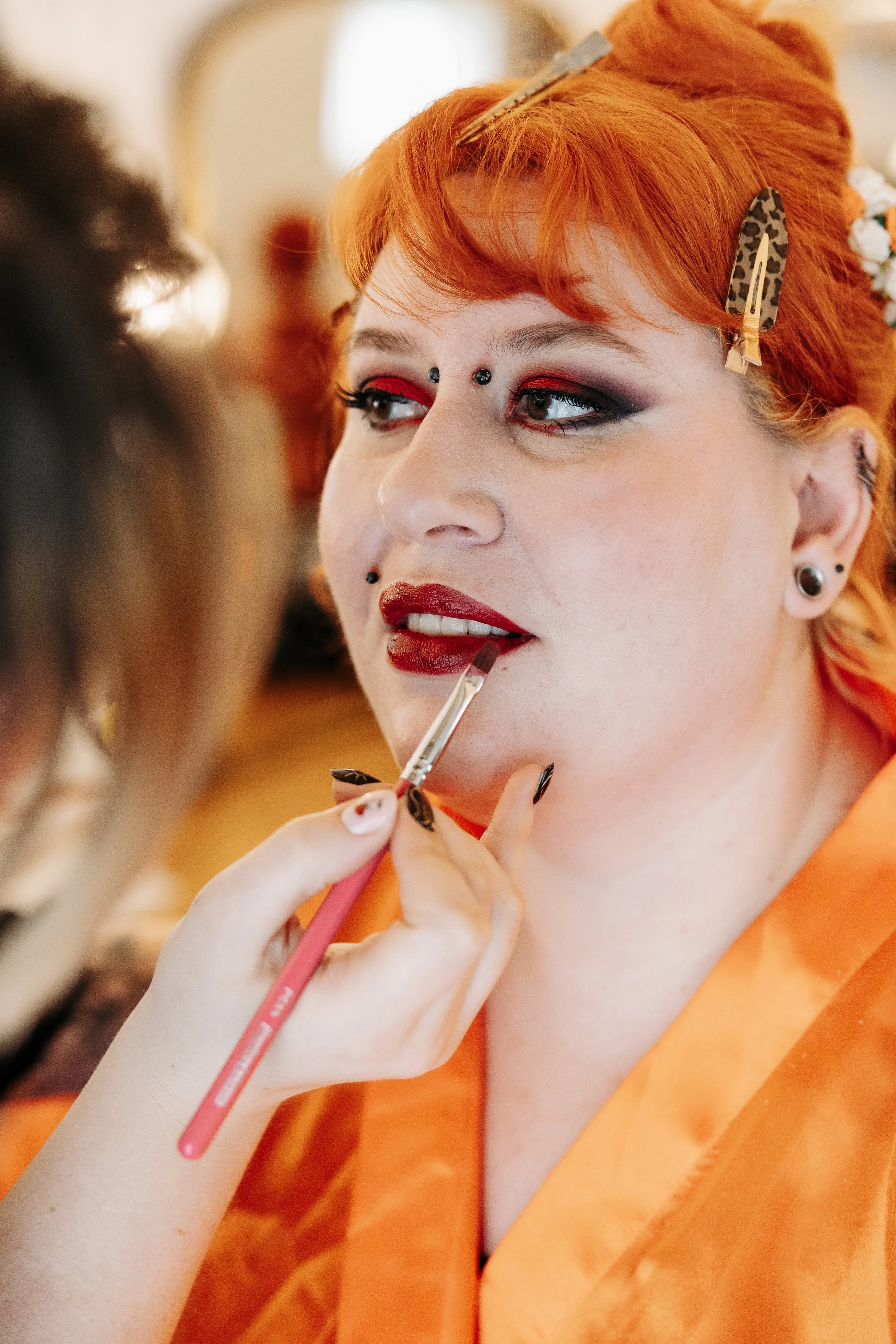 Bright red eye makeup and red lipstick. Hair & Makeup by Katie. Photo taken by Lauren Mitchell Photography