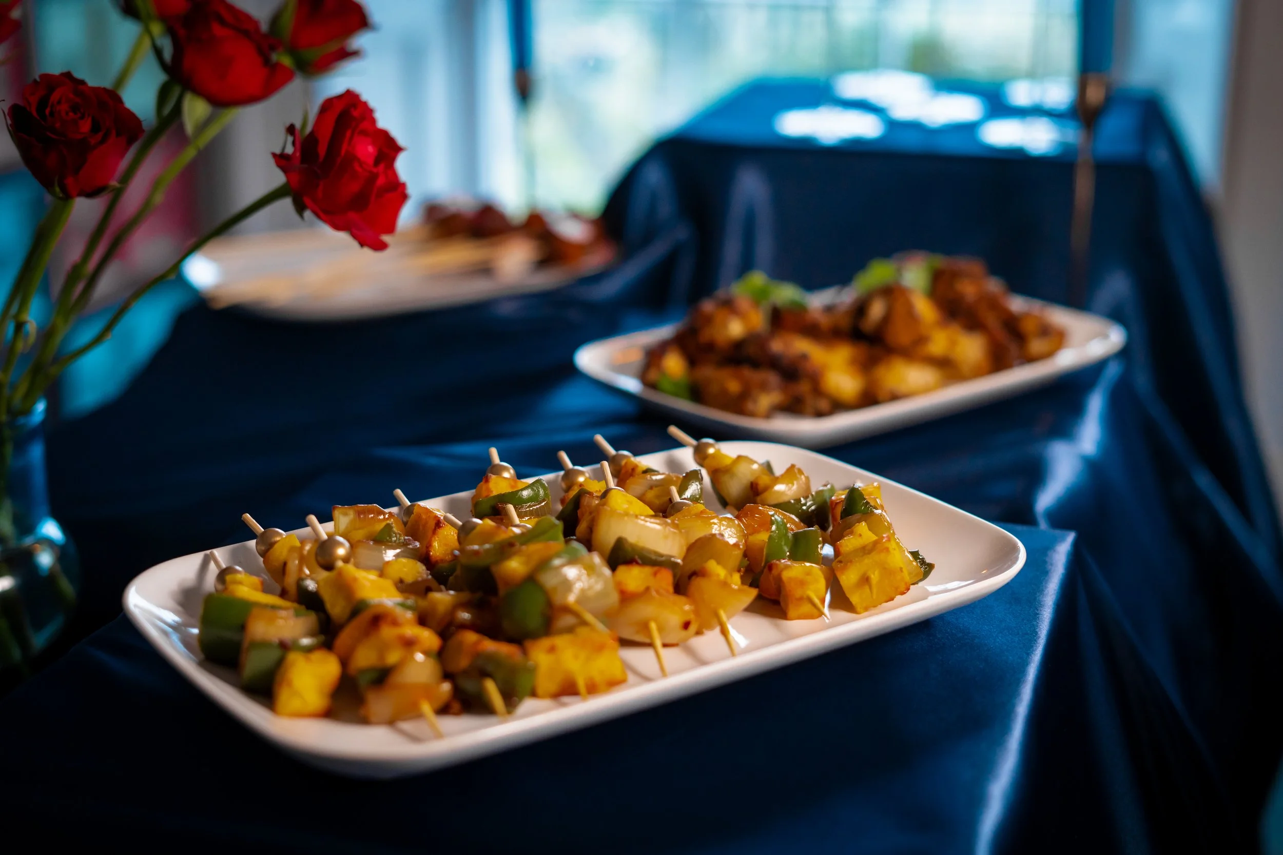 paneer skewers on a navy table cloth