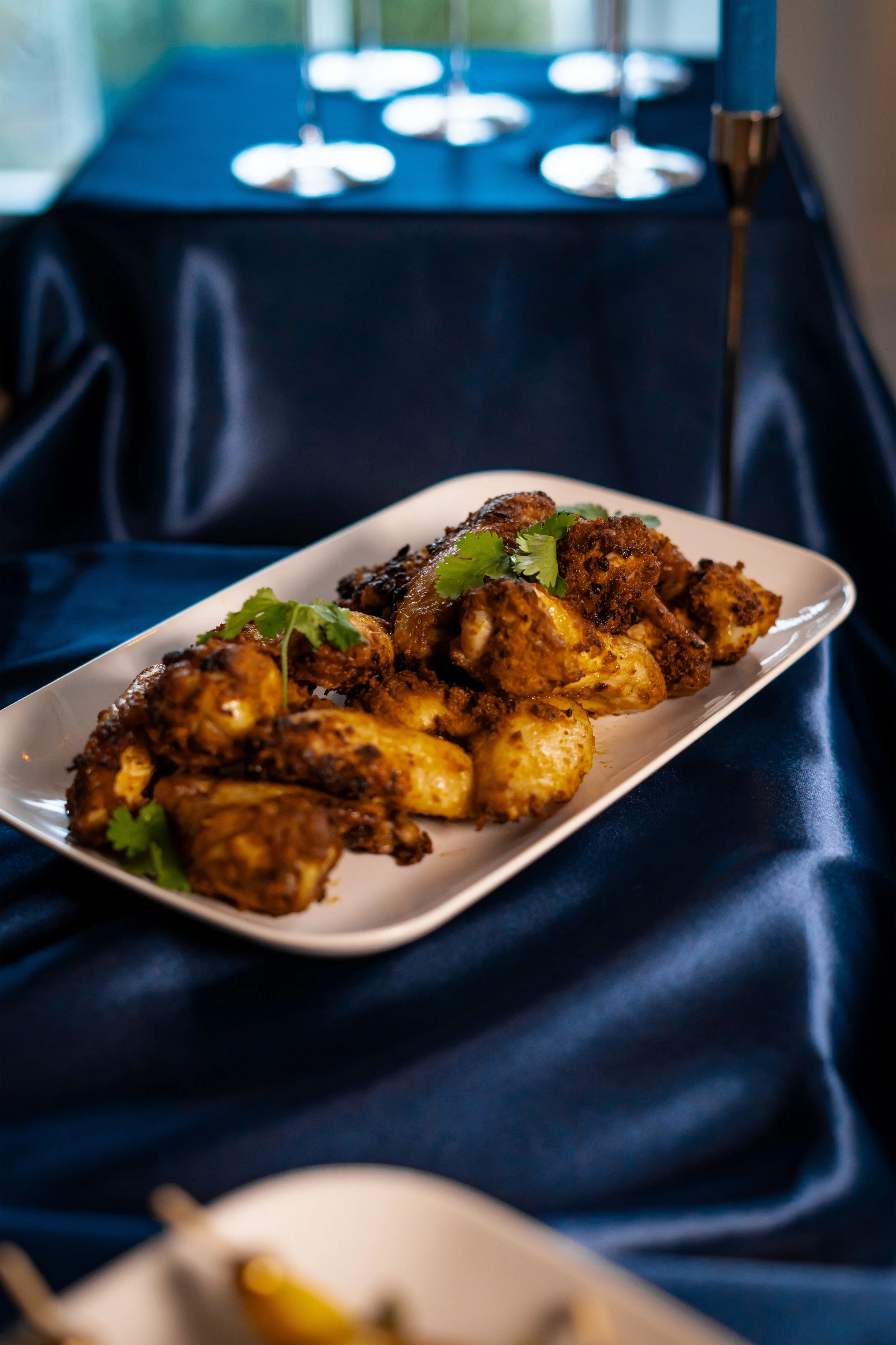 chicken wings on navy tablecloth