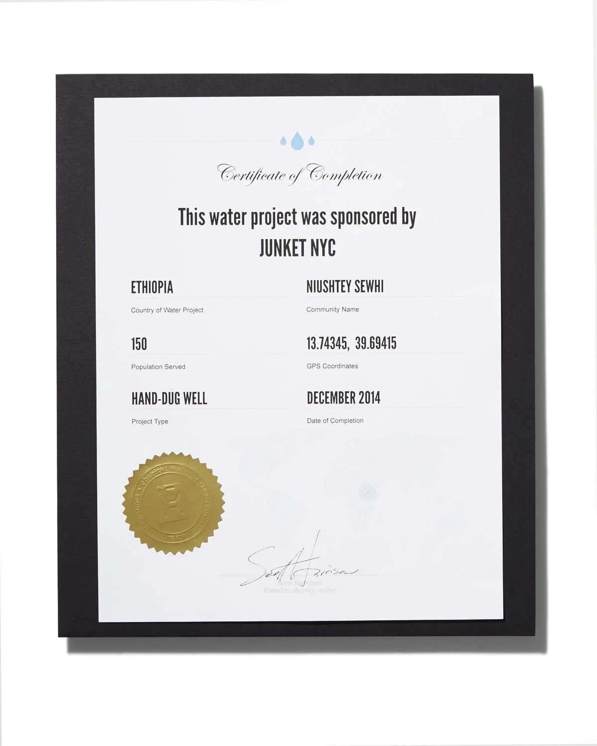 Certificate of Completion for a water project sponsored by Junket NYC, awarded to Niushtay Sewhi for a hand-dug well in Ethiopia, completed in December 2014, featuring a gold seal and the signature of Scott Hadison.
