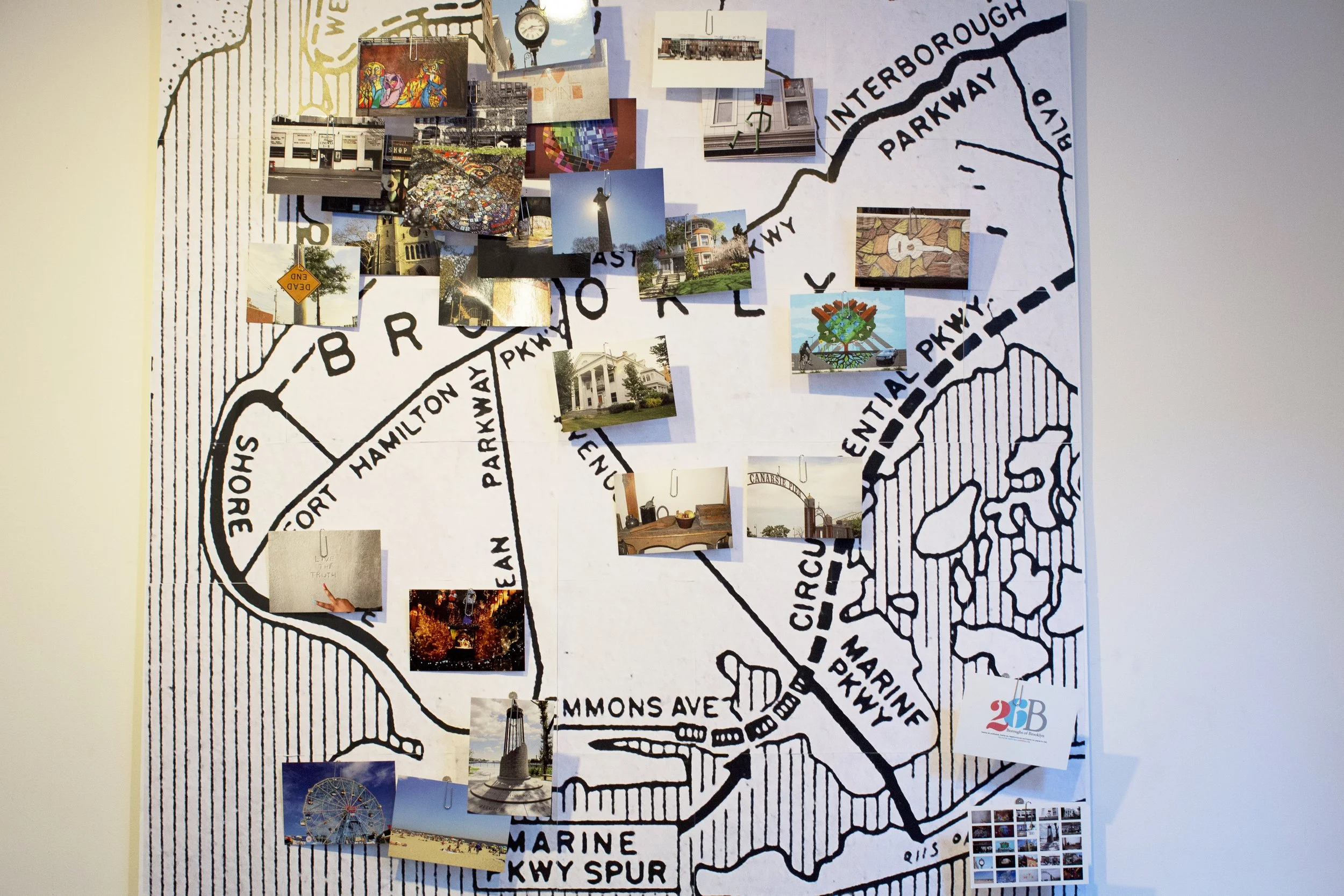 A map of Brooklyn with numerous photographs pinned onto various locations, showcasing local landmarks, artworks, and community scenes.