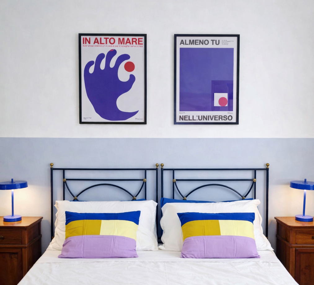 Double bedroom at Palazzo Dolce Vita, featuring a double bed, soft colours and contemporary art.