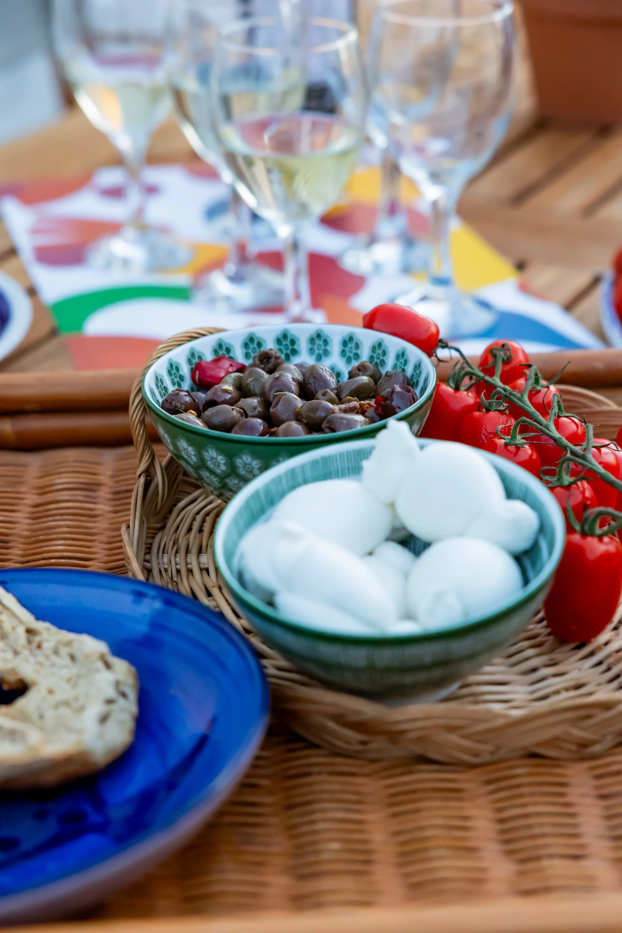 Salento-style aperitivo on the outdoor kitchen table at Palazzo Dolce Vita, celebrating simple flavours and shared moments.