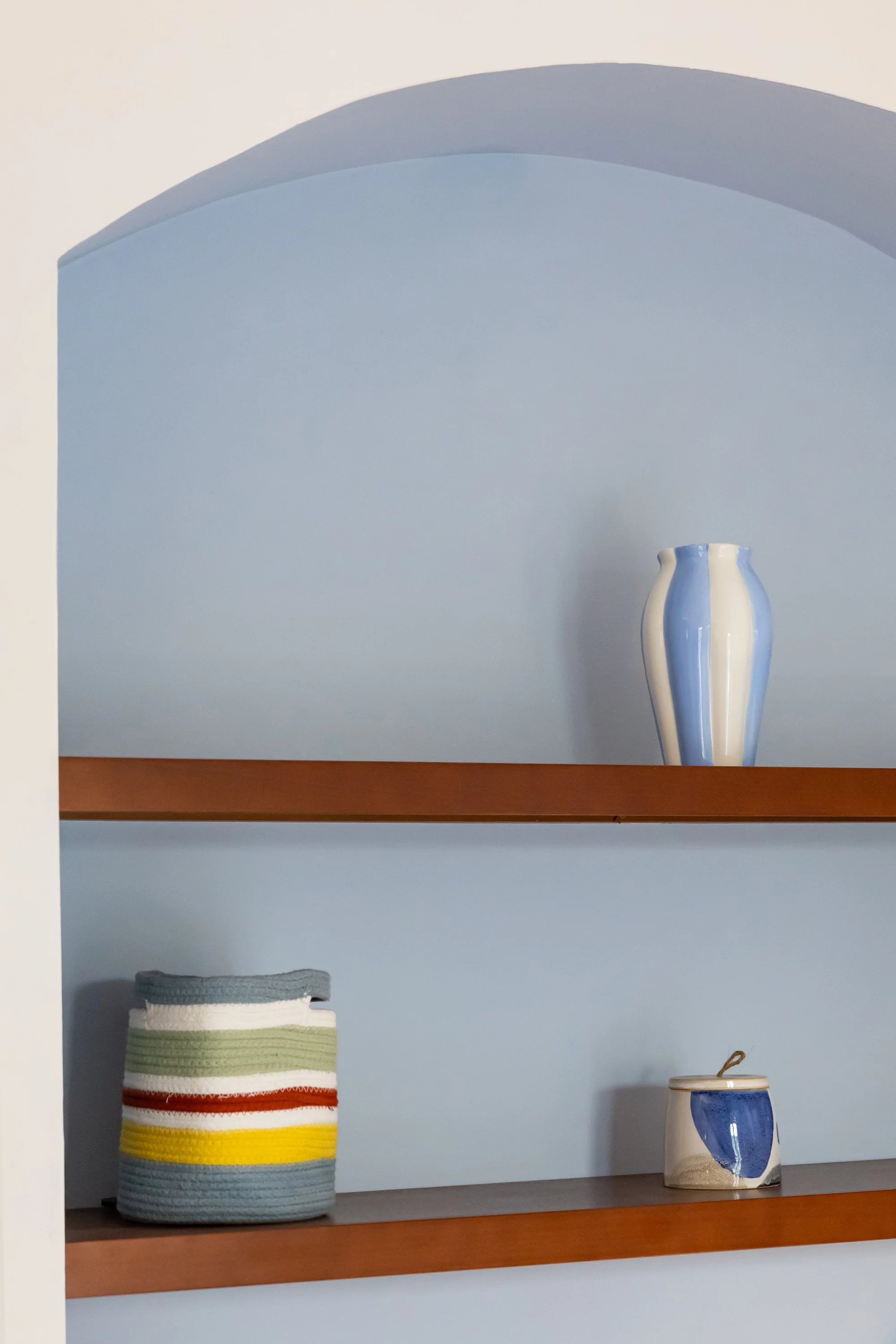 Arched bookshelf detail in the bedroom with private balcony at Palazzo Dolce Vita.