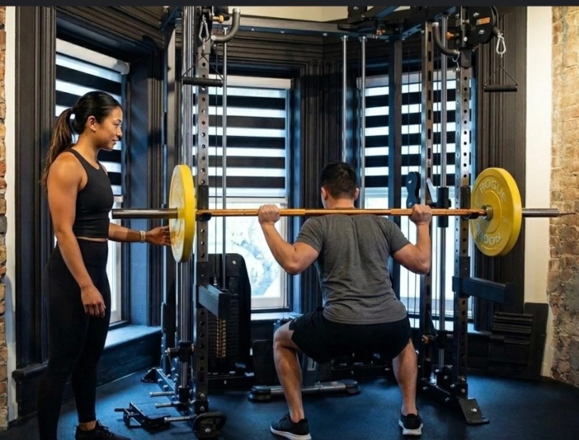 Trainer with client doing squat.jpg