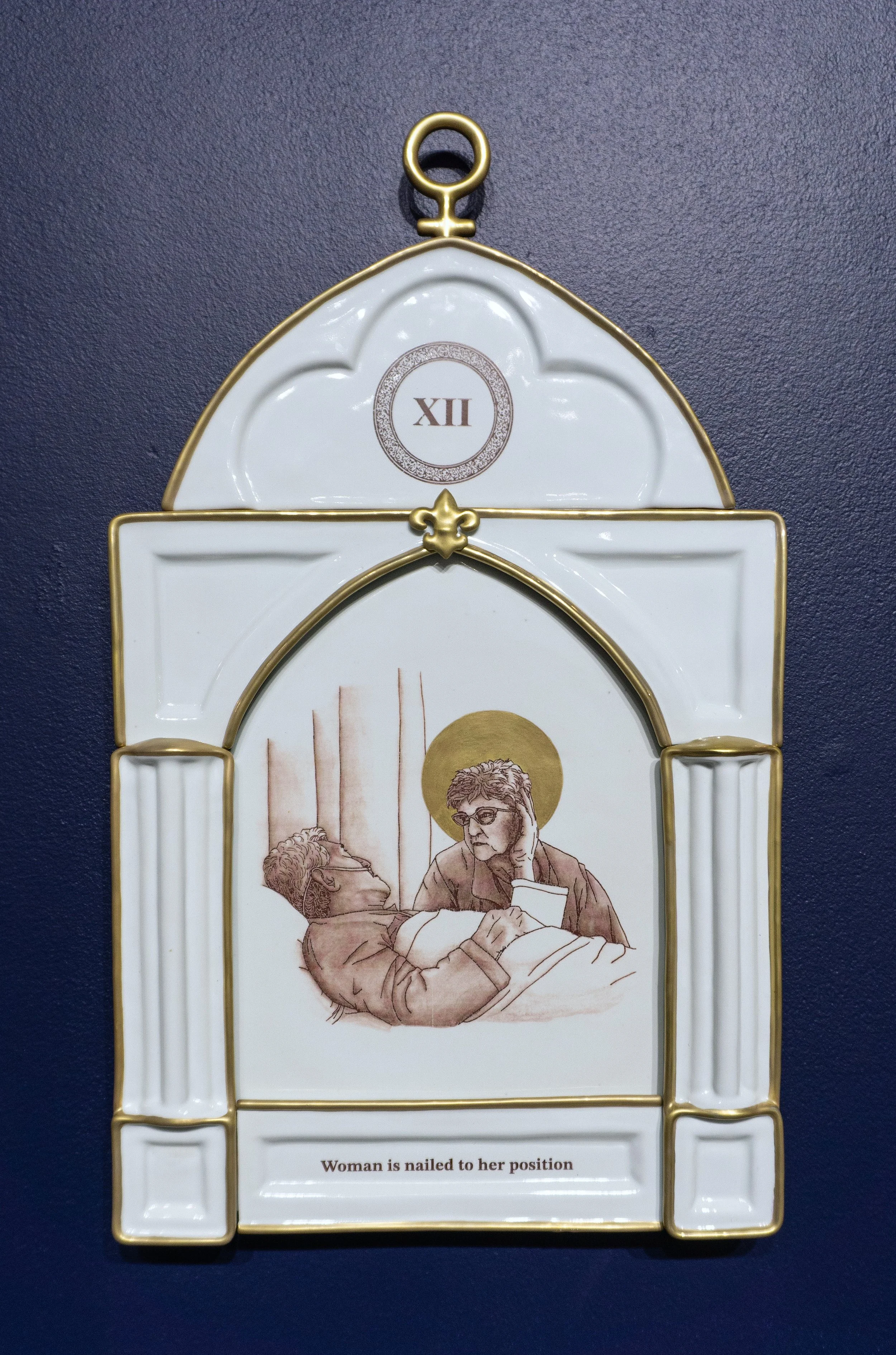 12. Woman is nailed to her position