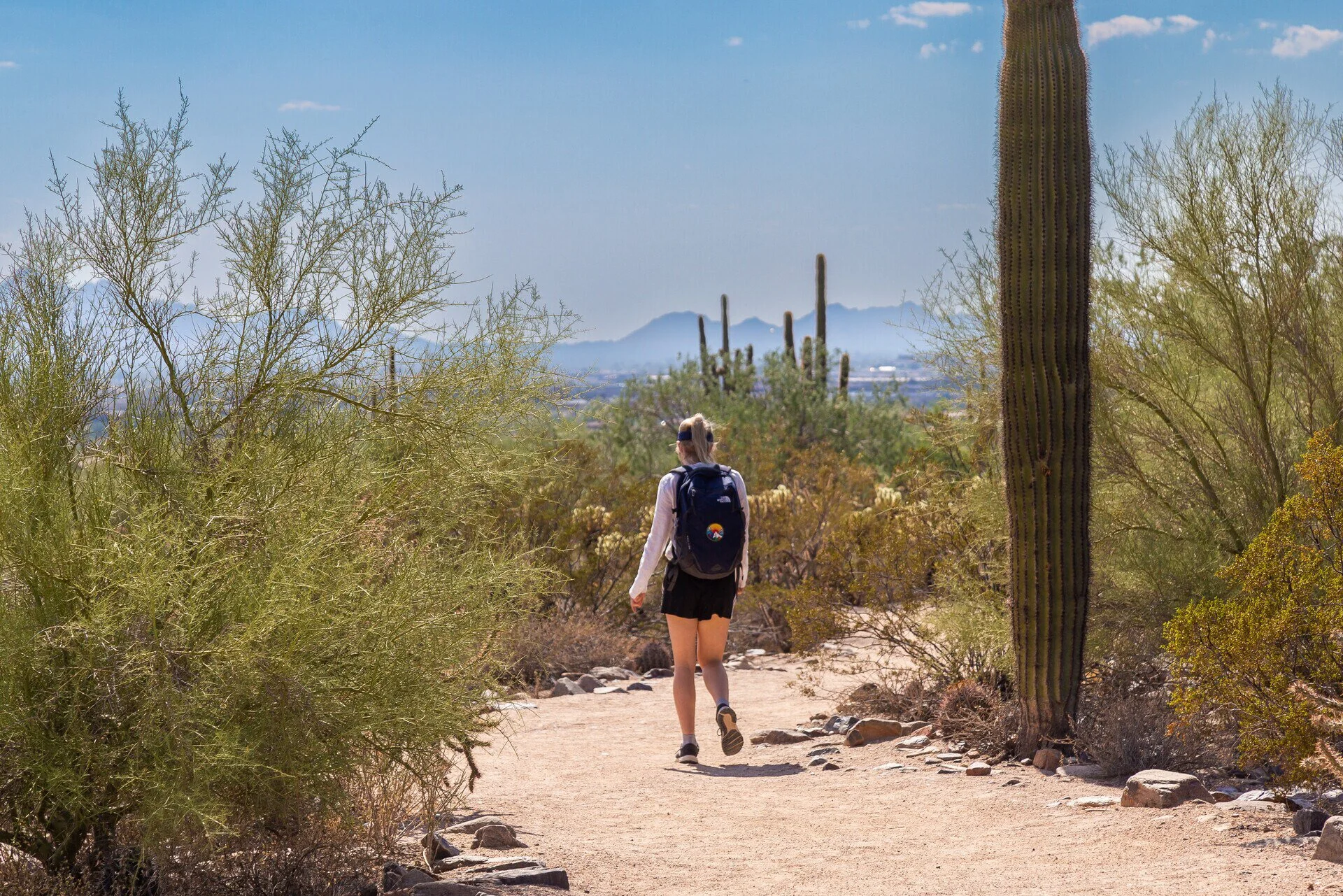 A woman walking on one of DC Ranch's many walkable paths. Scottsdale, Arizona.