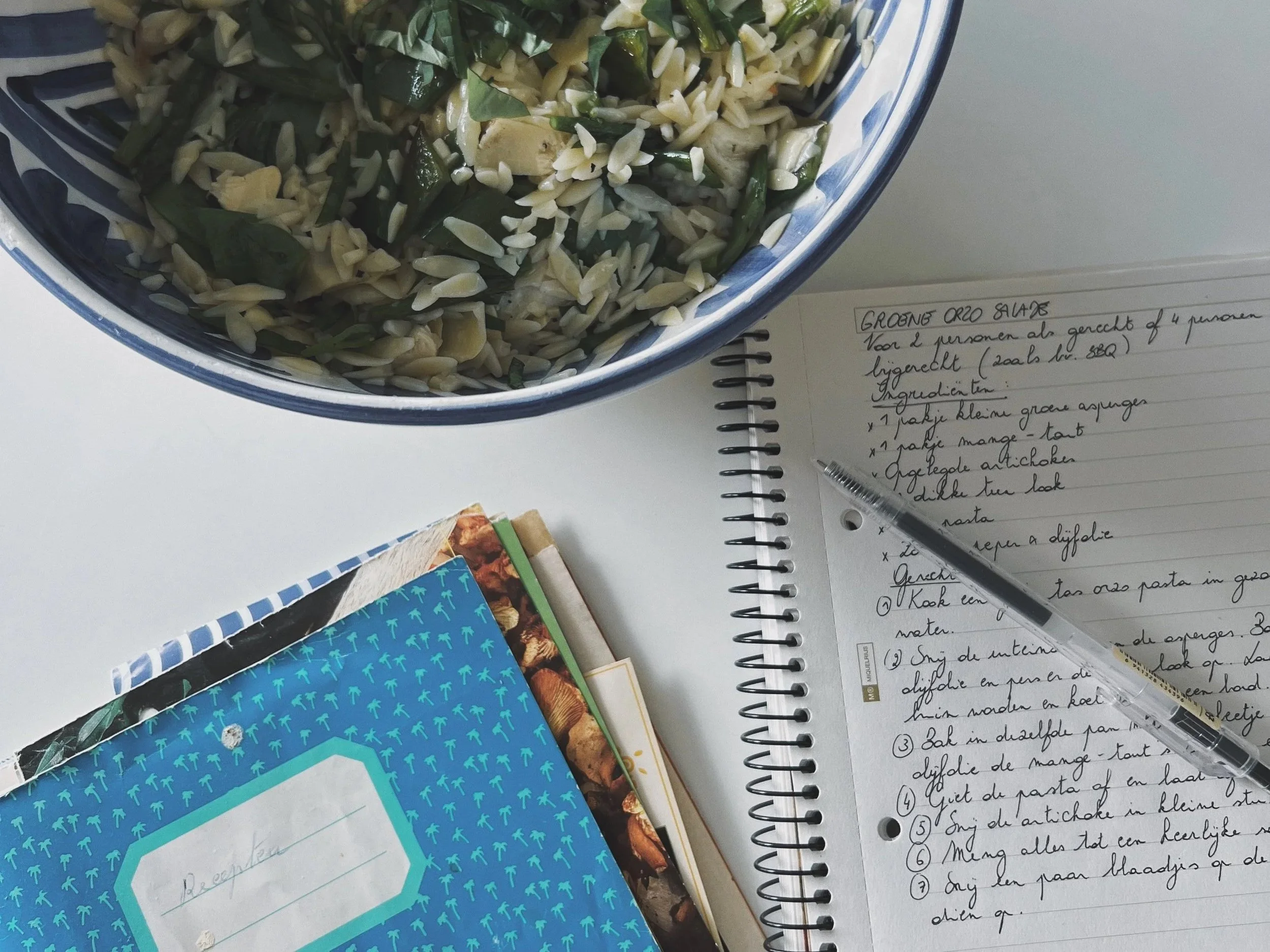 Green orzo salad bowl, old recipe notebook from my grandma and a recipes I wrote for the salad