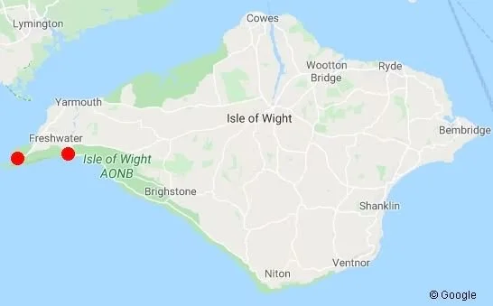 Map of the Isle of Wight showing towns and locations, with two red dots on the western coast.