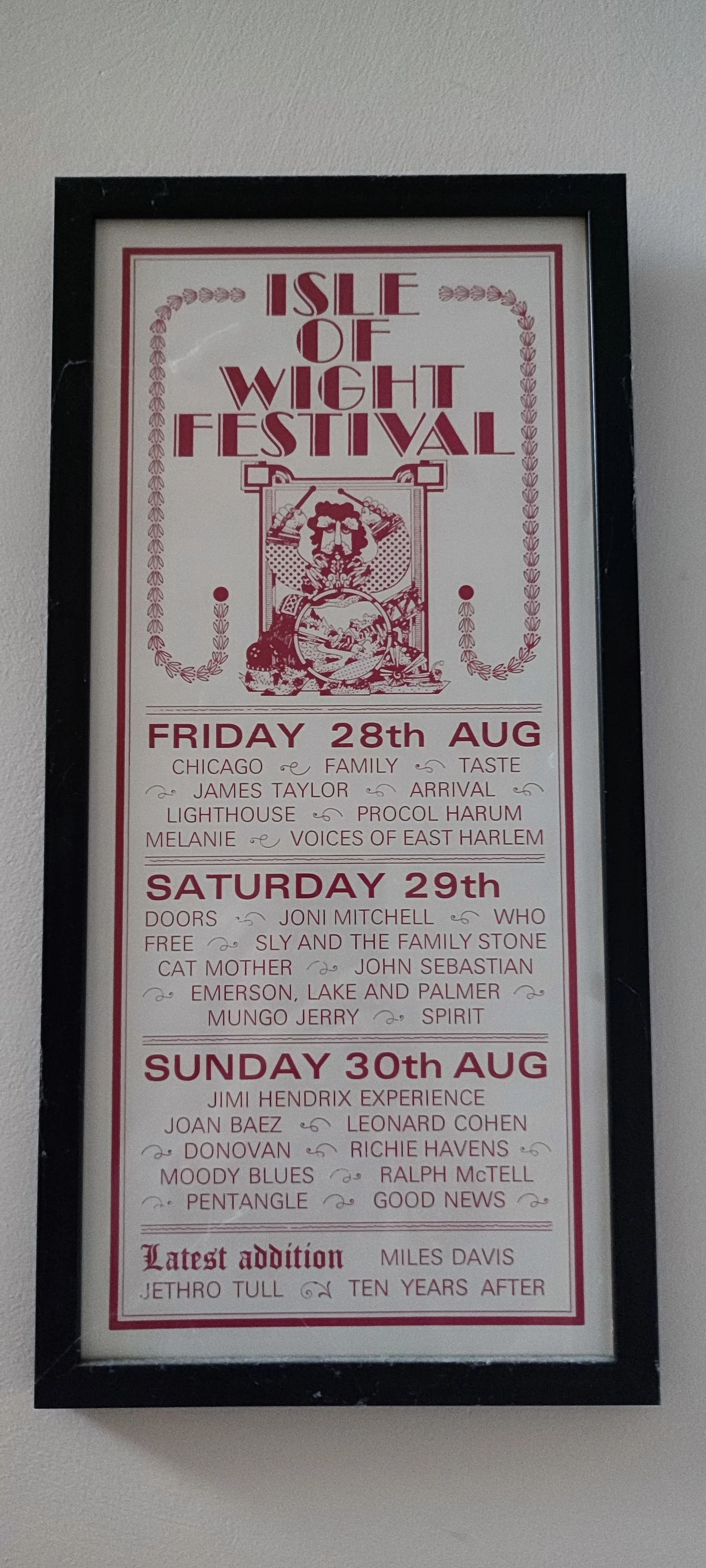 Schedule poster for Isle of Wight Festival with dates August 28th to 30th, listing various performers such as James Taylor, Leonard Cohen, Joan Baez, and Jimi Hendrix Experience.